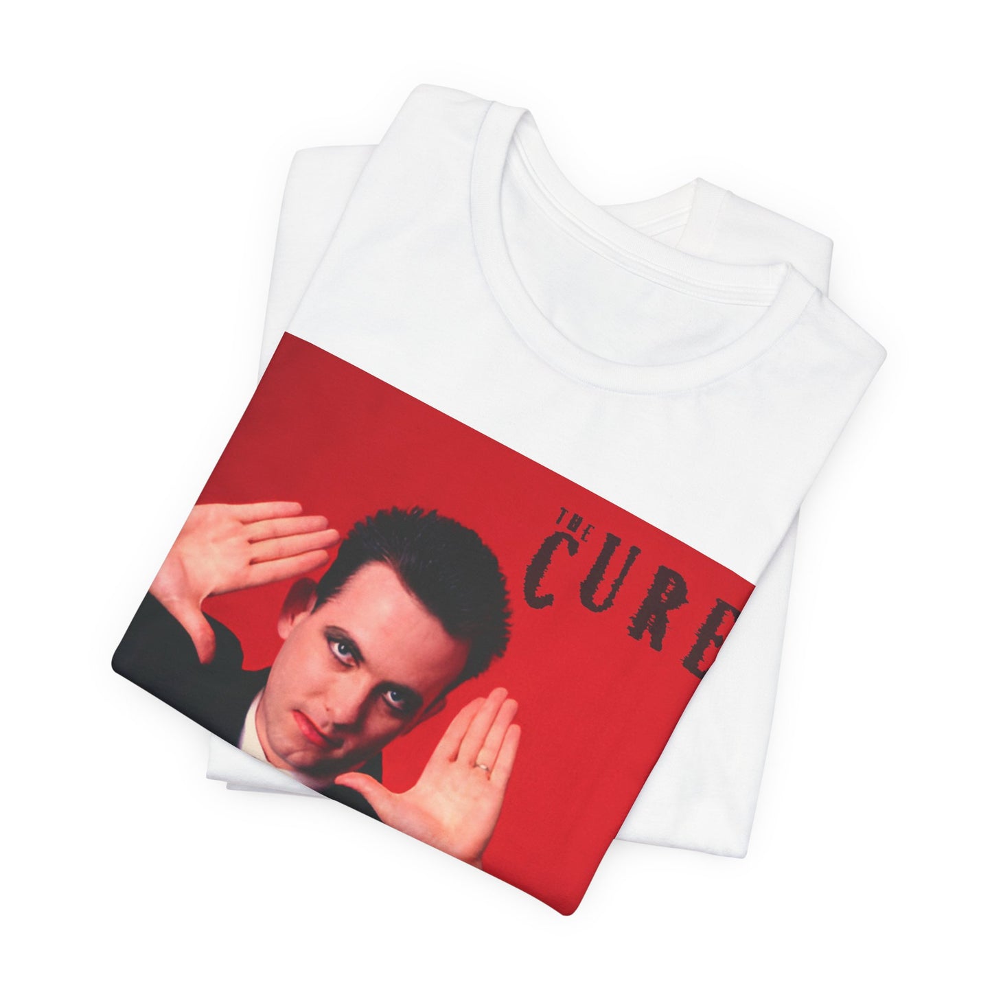 A black graphic t-shirt featuring a graphic of Robert Smith from The Cure in his authentic style.