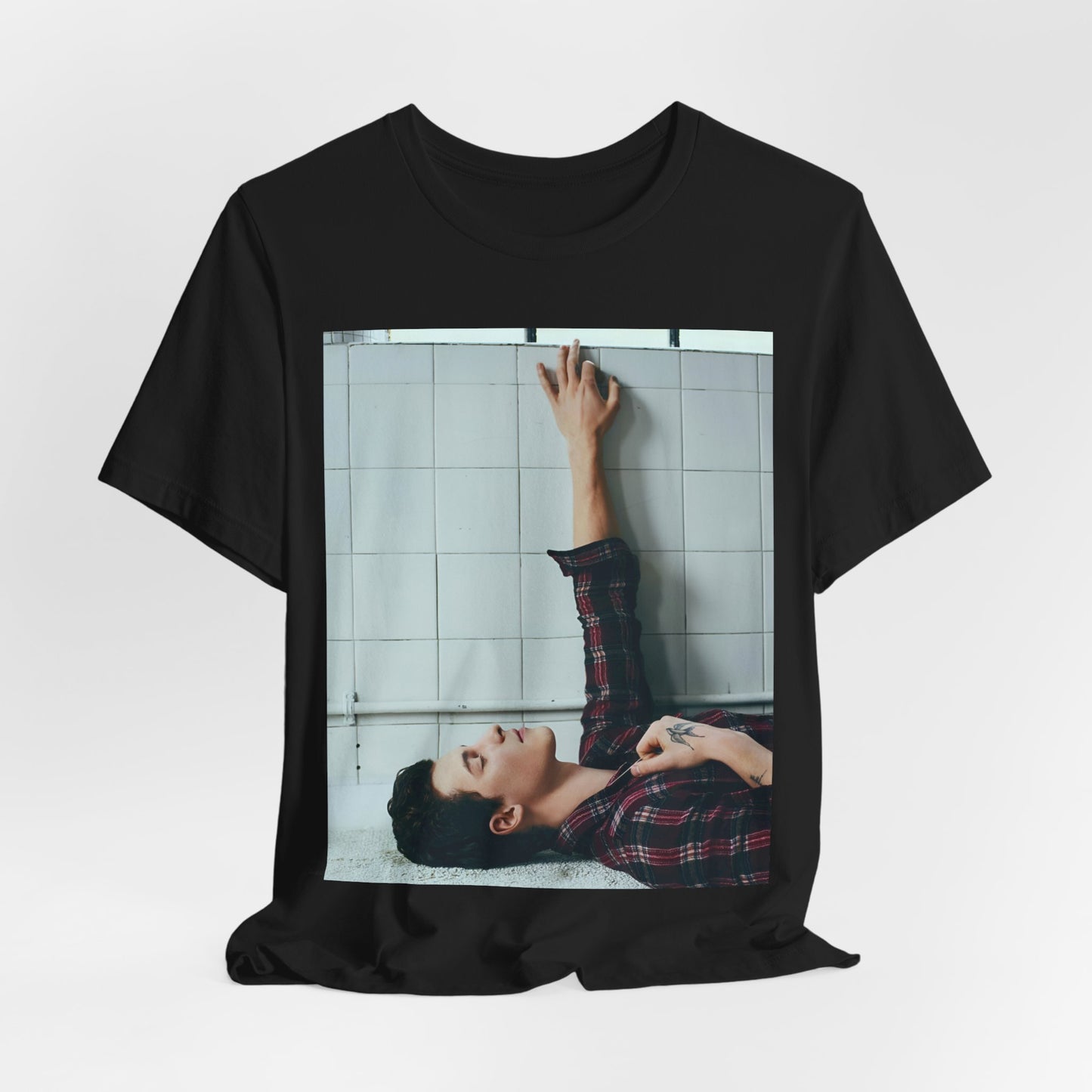 A black graphic t-shirt featuring a bold graphic of Shawn Mendes as a superstar.