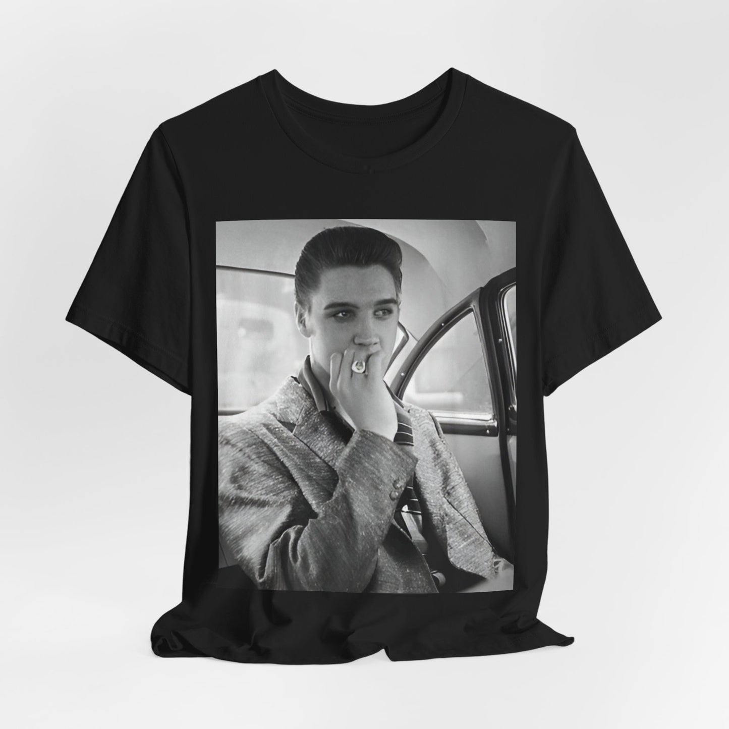 A black graphic t-shirt featuring a classic 50s era graphic of Elvis Presley.