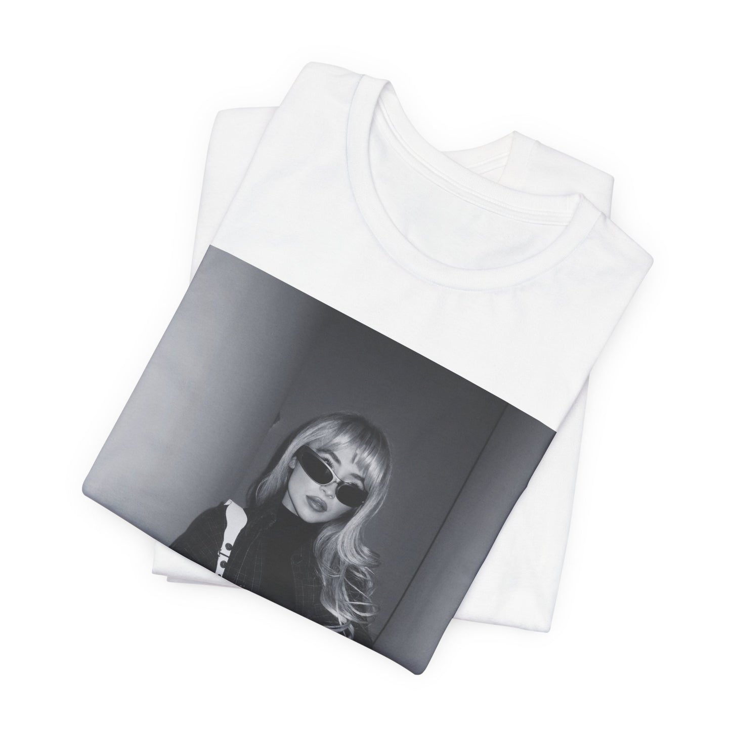 A black graphic t-shirt featuring a black and white glam pop diva graphic of Sabrina Carpenter.