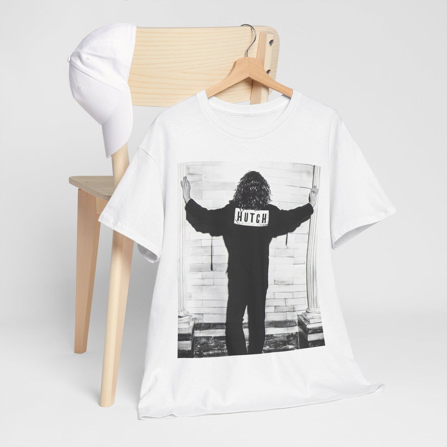 A black graphic t-shirt featuring a graphic of Michael Hutchence from INXS, labeled 'Hutch'.