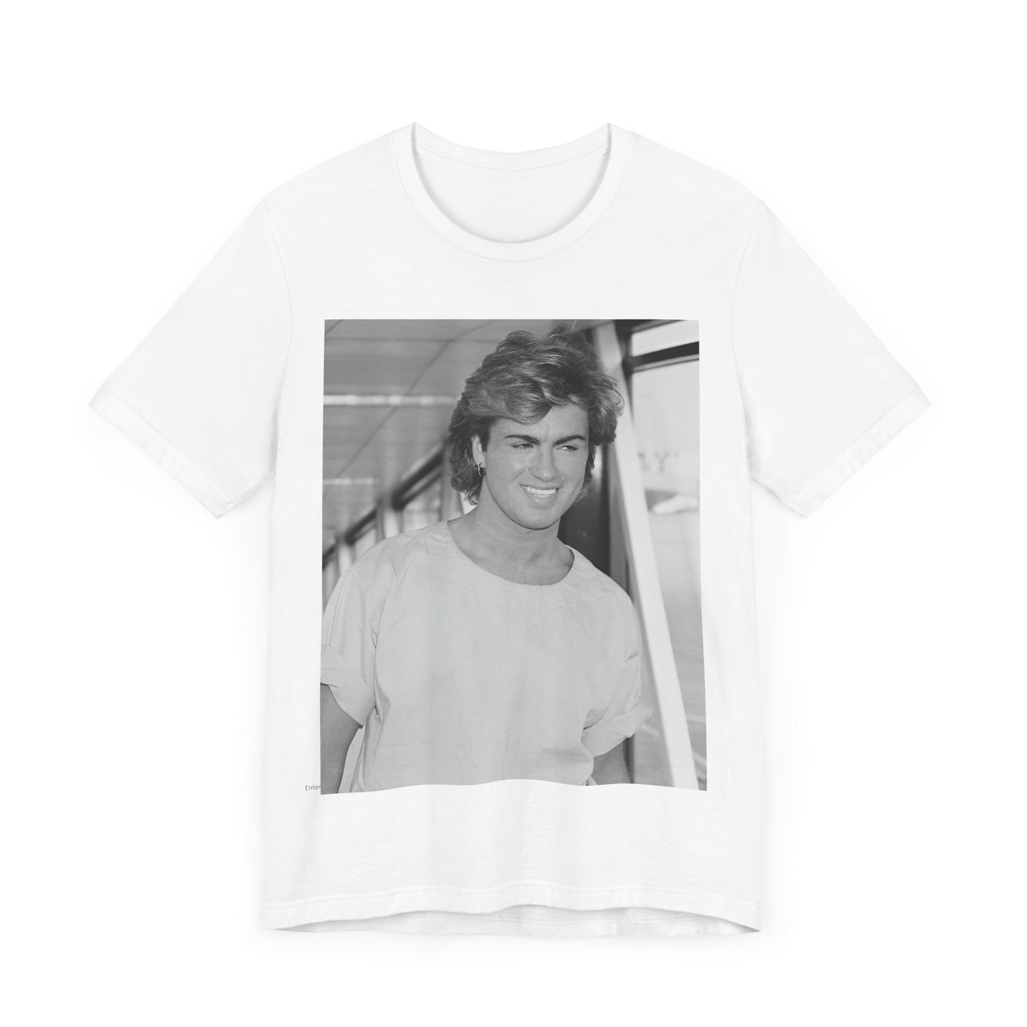 A black graphic t-shirt featuring an 80s black and white vintage photo or graphic of George Michael.
