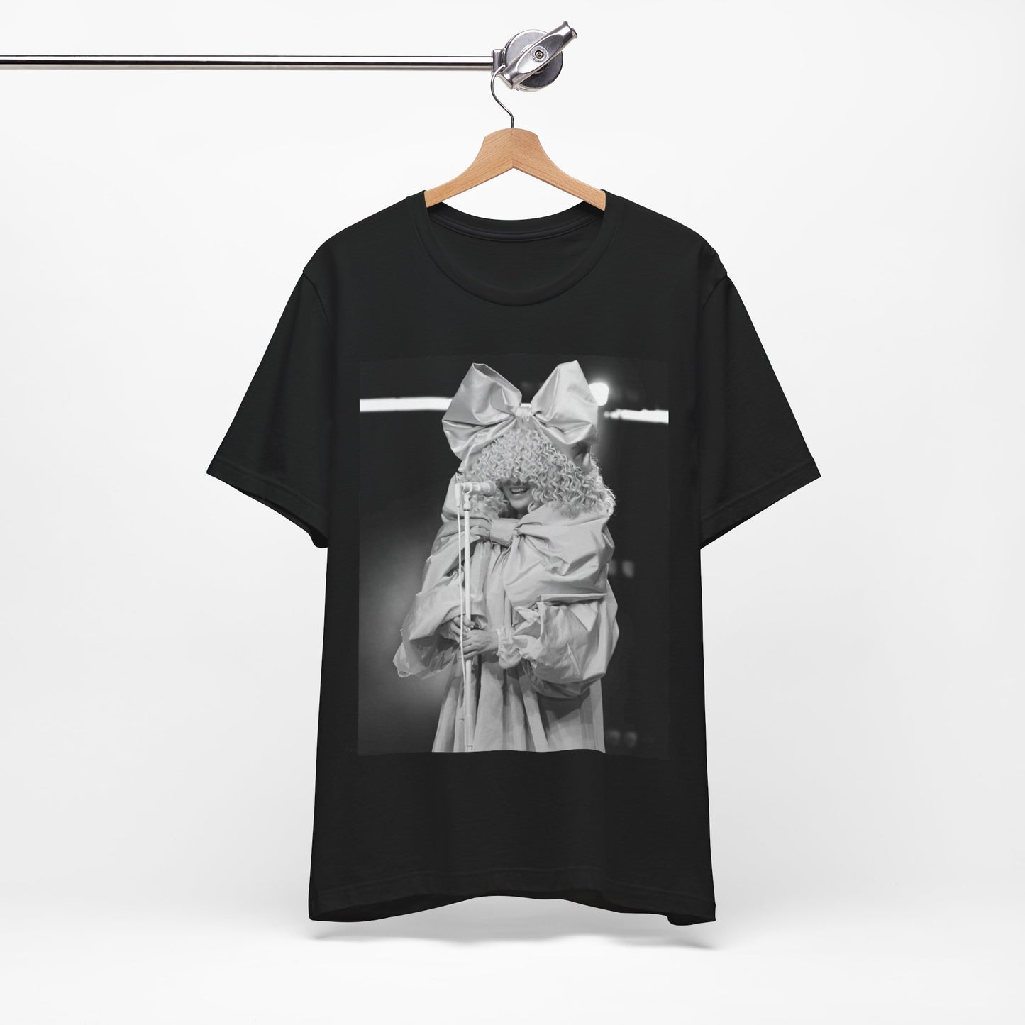 A black graphic t-shirt featuring a black and white, monochrome graphic or photo of Sia.