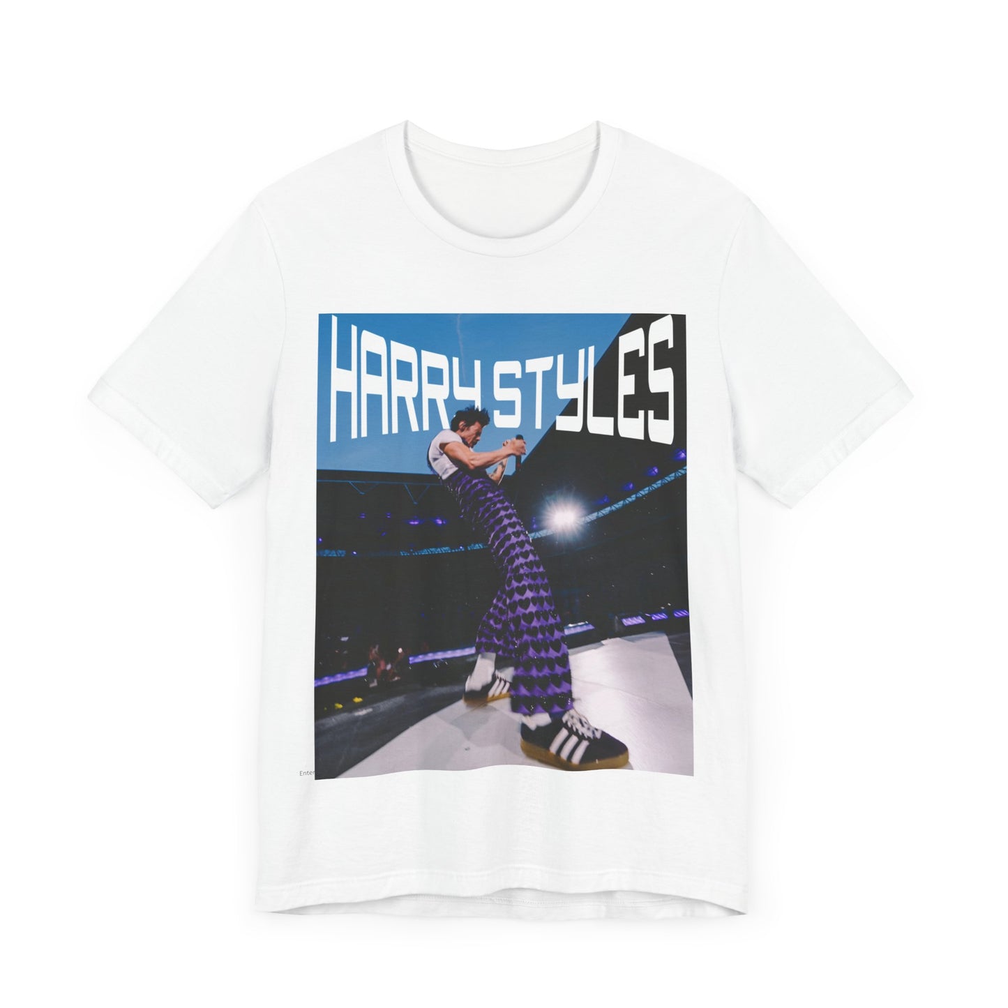 A black graphic t-shirt featuring a graphic or photo of Harry Styles performing live in concert.