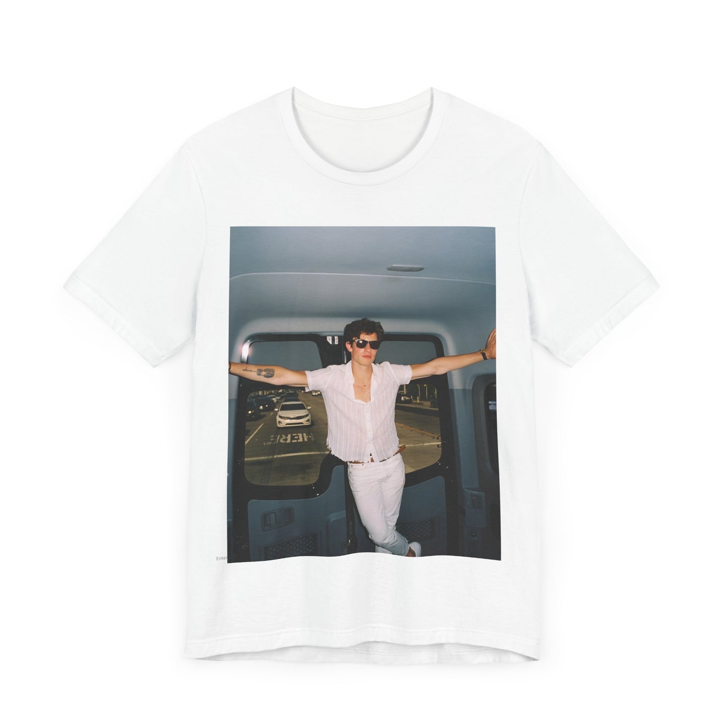A black graphic t-shirt featuring a graphic of Shawn Mendes with a classic confident look.