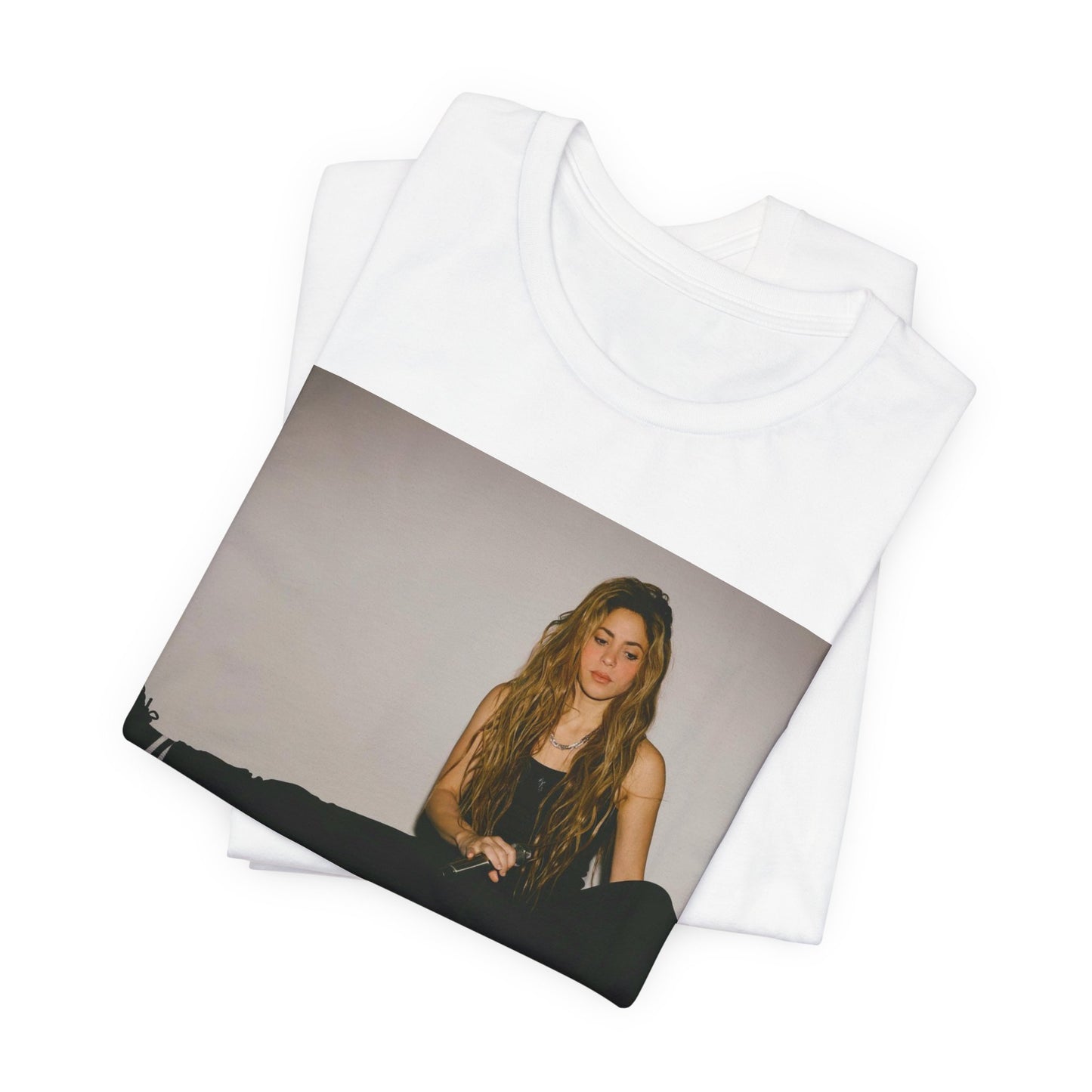 A black graphic t-shirt featuring a modern pop essential graphic of Shakira.