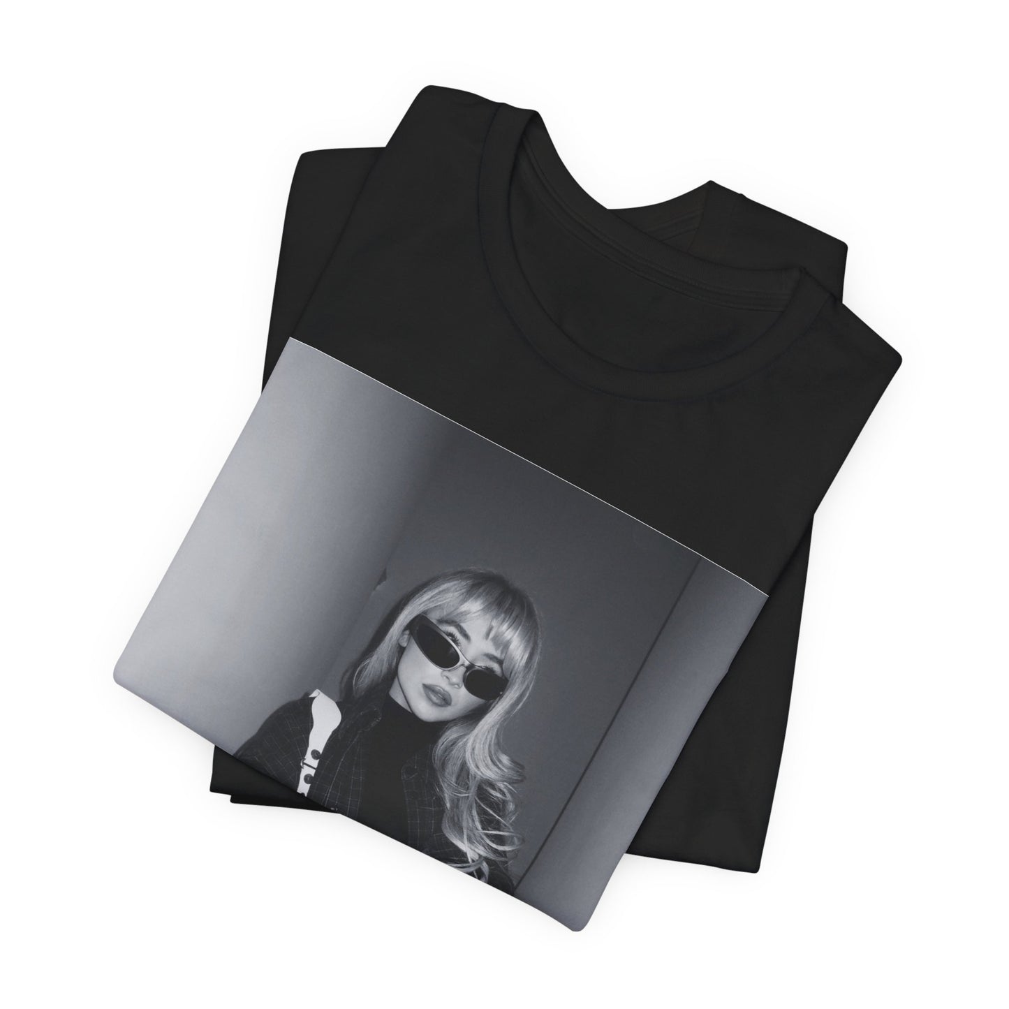 A black graphic t-shirt featuring a black and white glam pop diva graphic of Sabrina Carpenter.