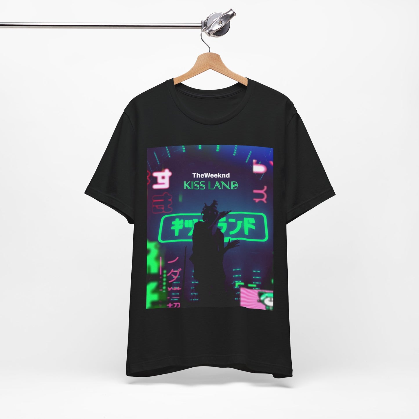 A black graphic t-shirt featuring a graphic related to The Weeknd's 'Kiss Land' live performances.