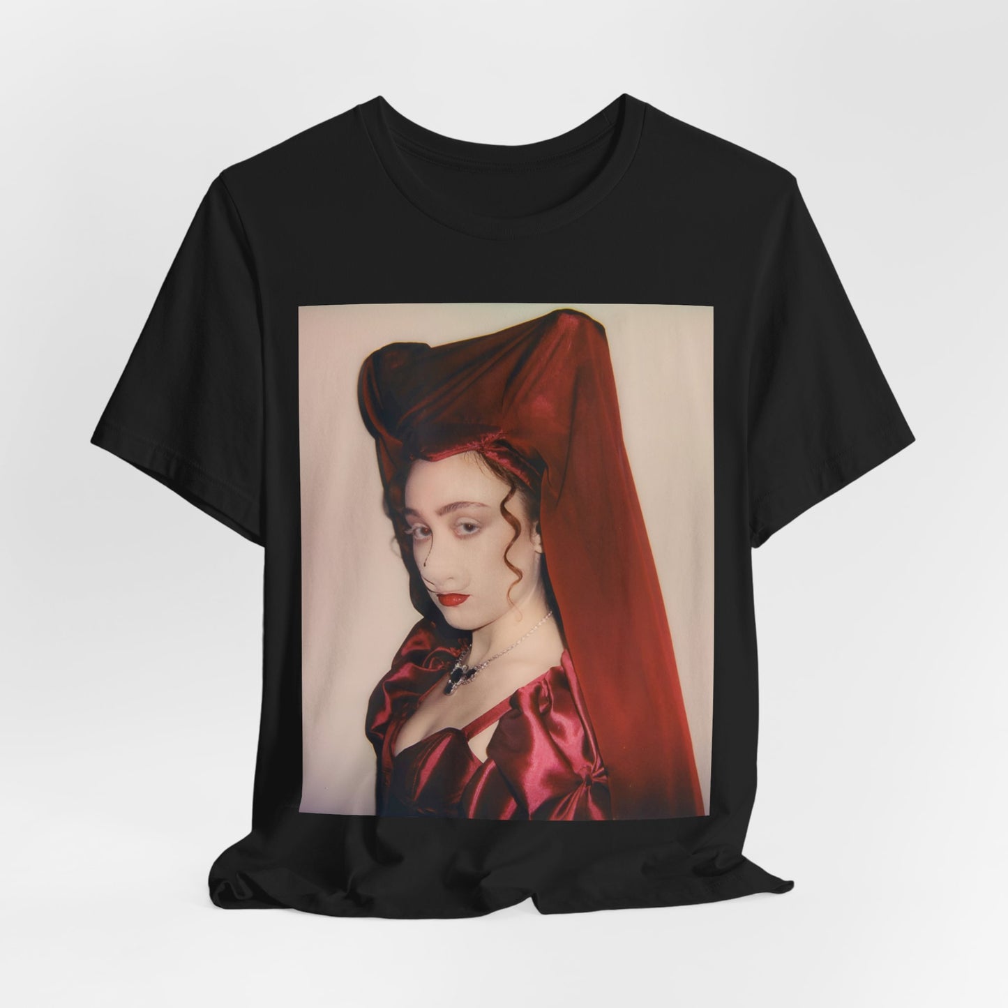 A black graphic t-shirt featuring a vintage-style graphic of Chappell Roan as a pop star.