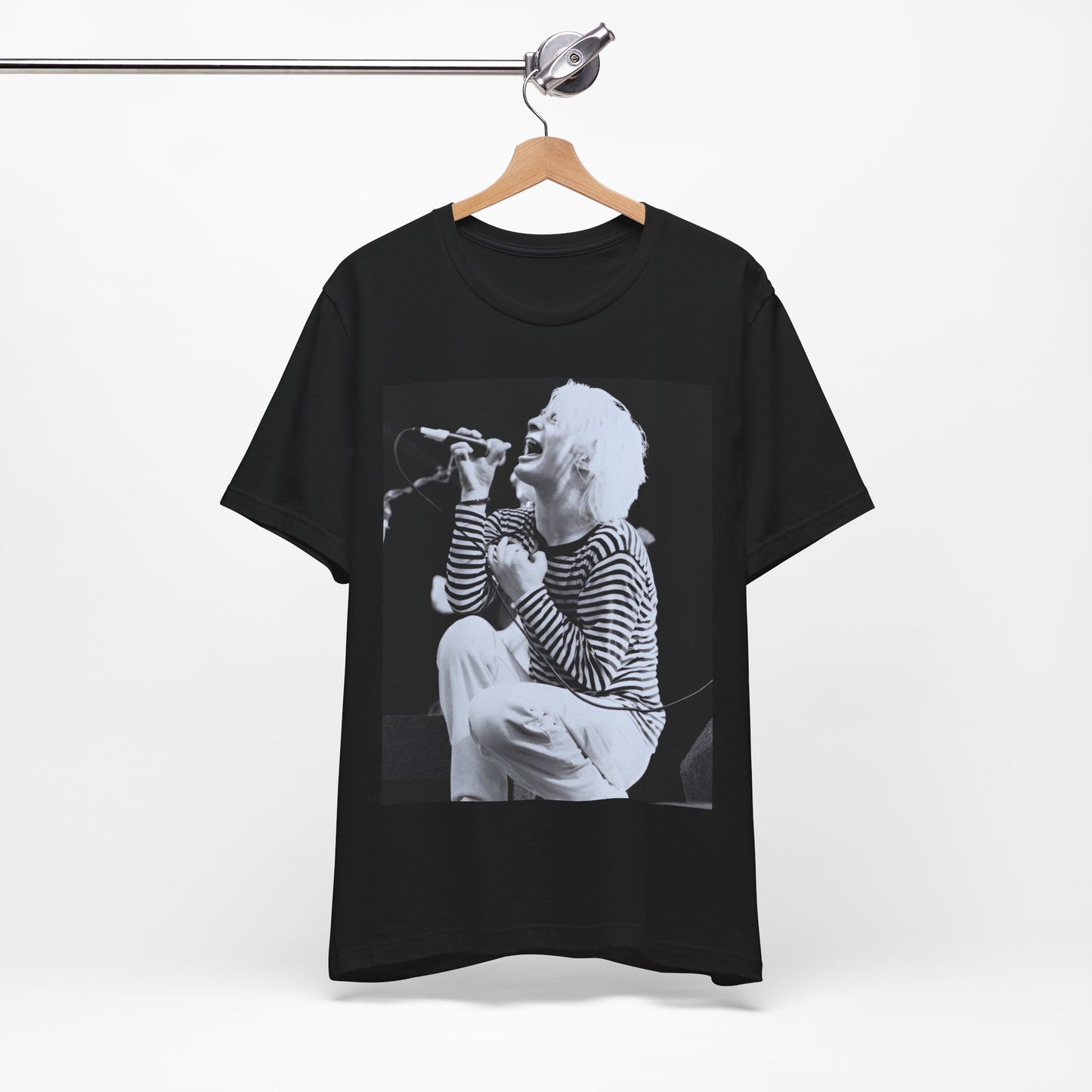 A black graphic t-shirt featuring a black and white graphic or photo of Radiohead performing live.
