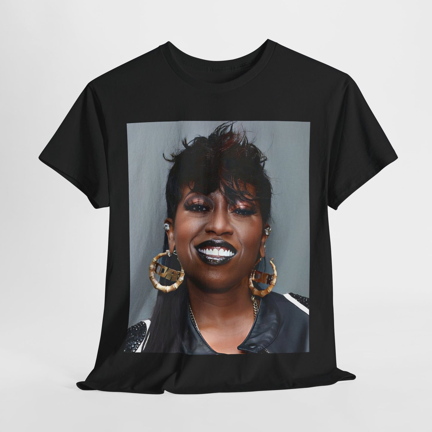 A black graphic t-shirt featuring a bold graphic of Missy Elliott as a rap superstar.