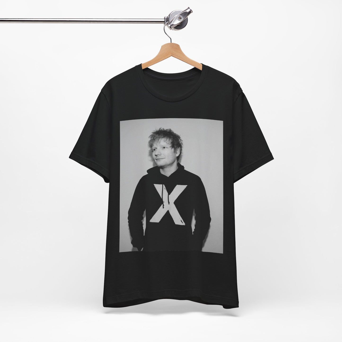 A black graphic t-shirt featuring a black and white graphic related to Ed Sheeran's album 'X'.