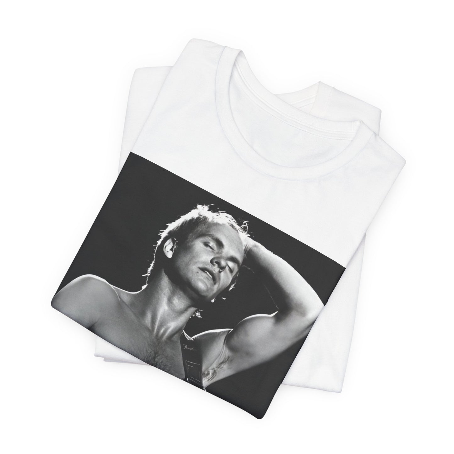 A black graphic t-shirt featuring a graphic or photo of Sting performing live on stage in 1983.