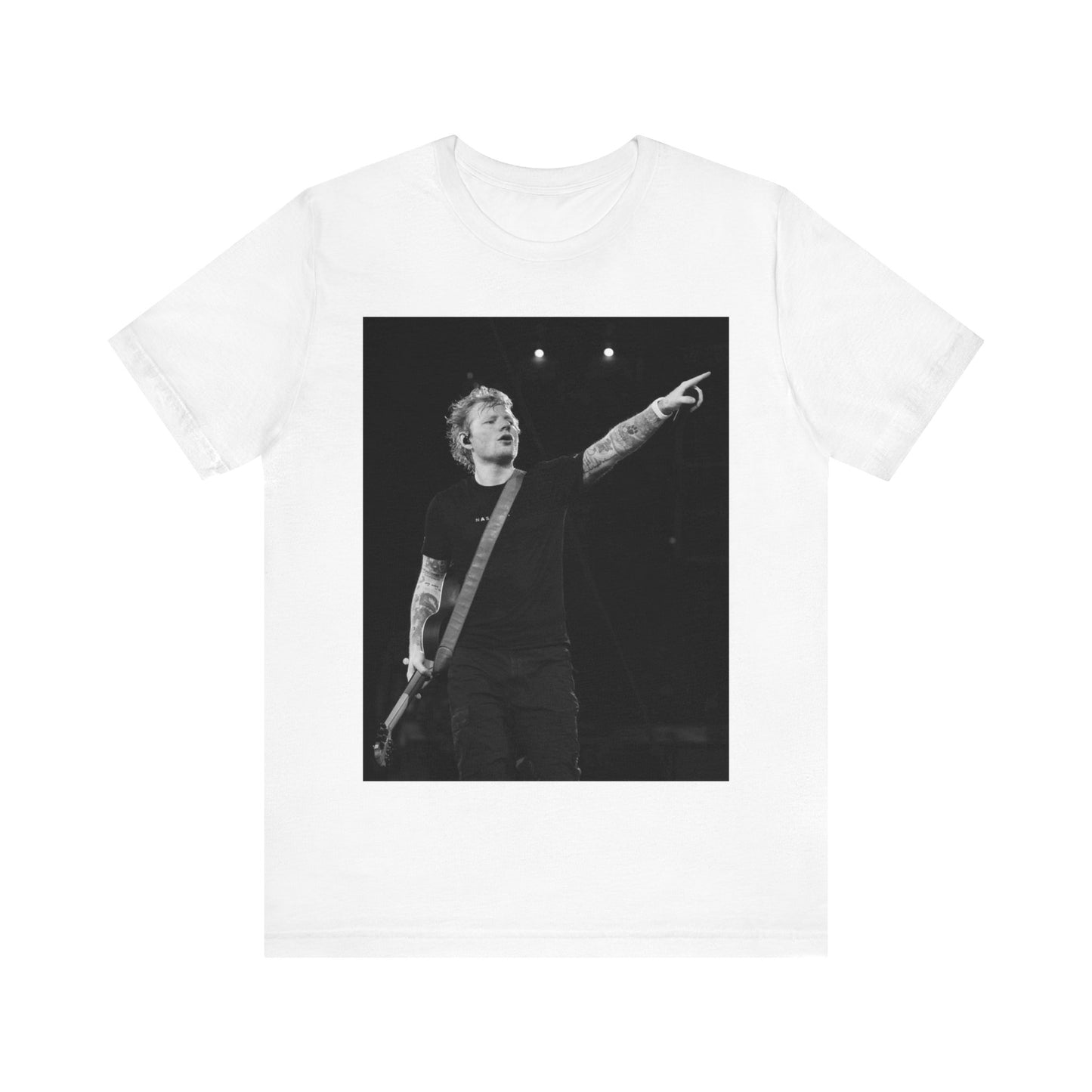 A black graphic t-shirt featuring a black and white graphic or photo of Ed Sheeran performing live on stage.
