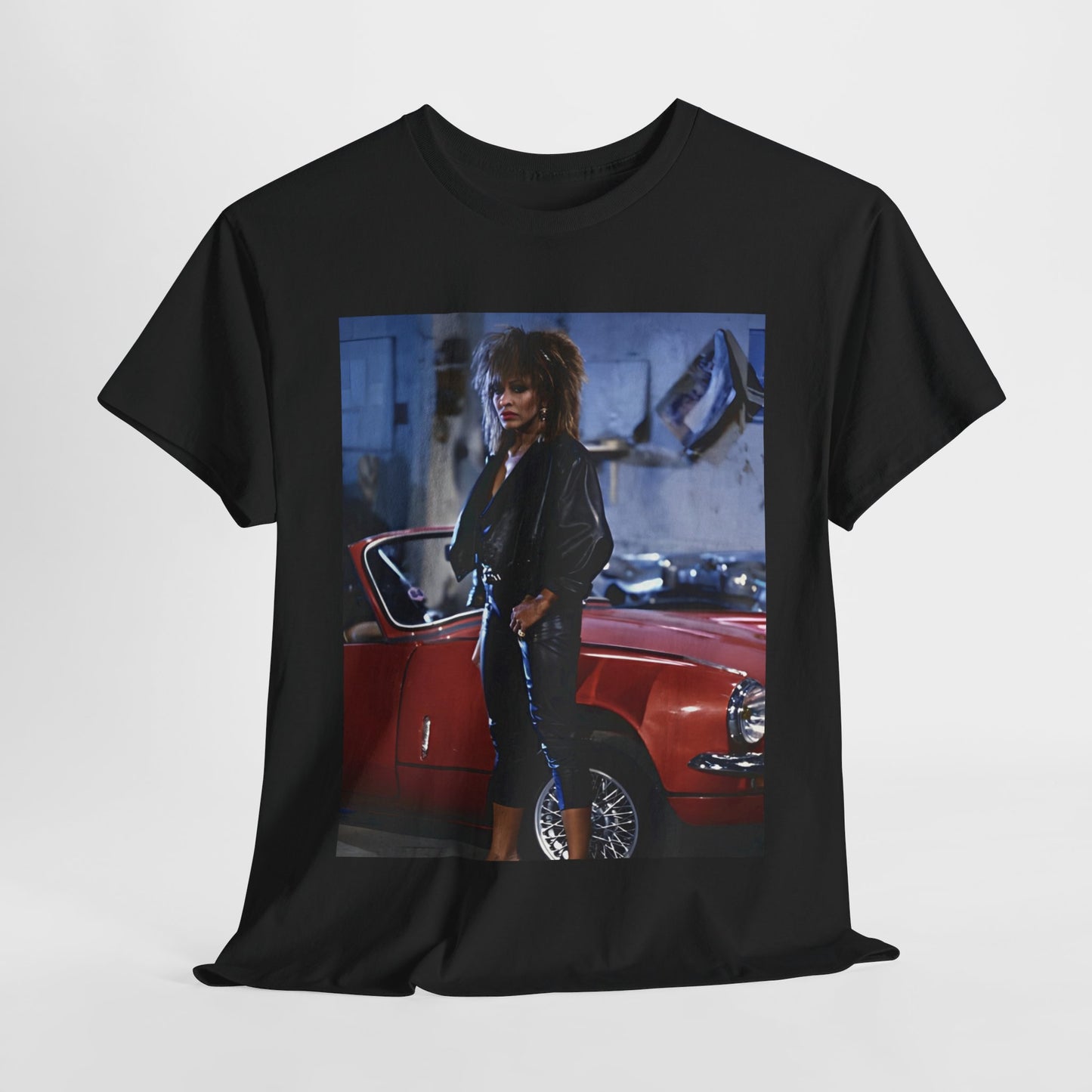 A black graphic t-shirt featuring an 80s graphic of Tina Turner as a powerful rock woman.