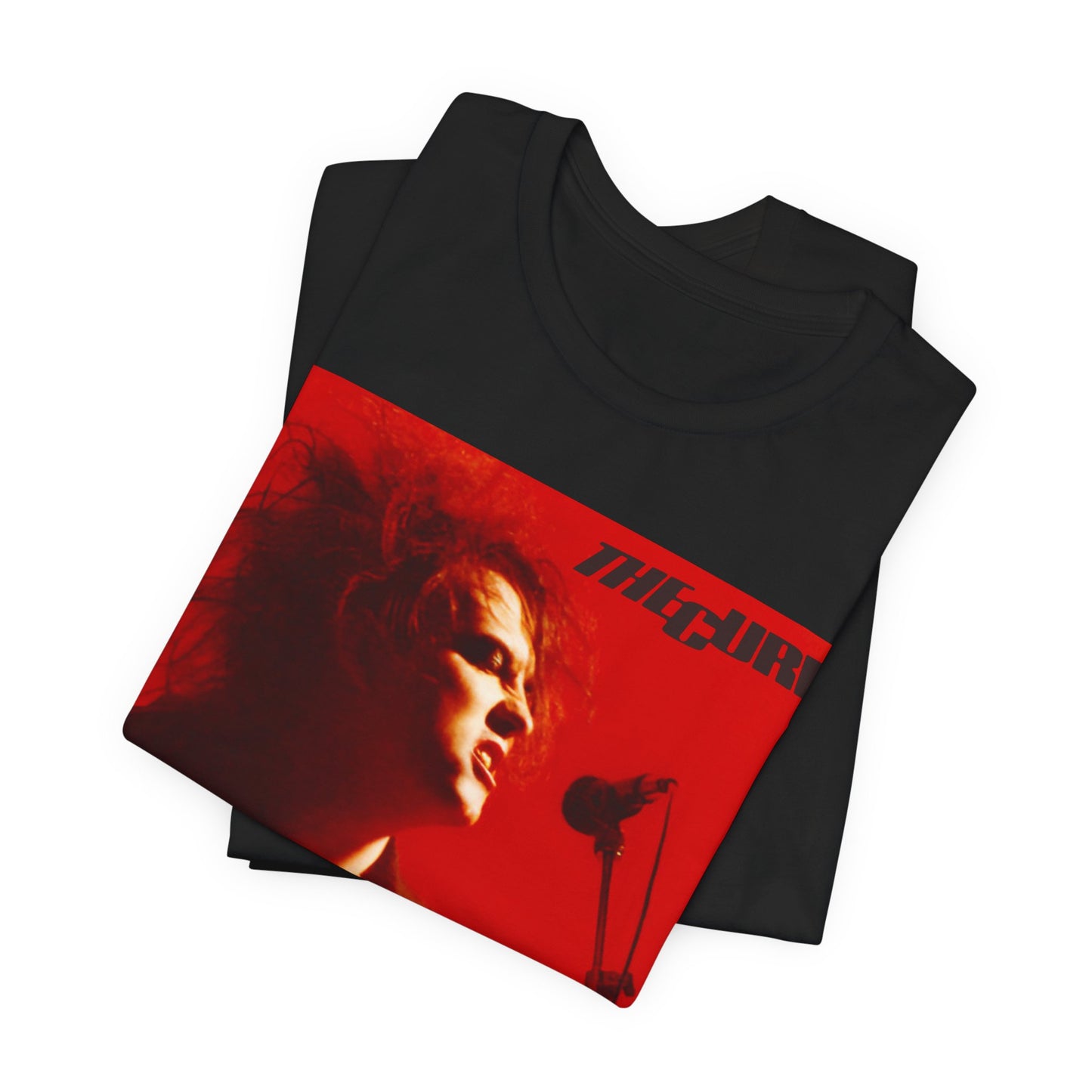 A black graphic t-shirt featuring a graphic of Robert Smith from The Cure with iconic red lipstick.