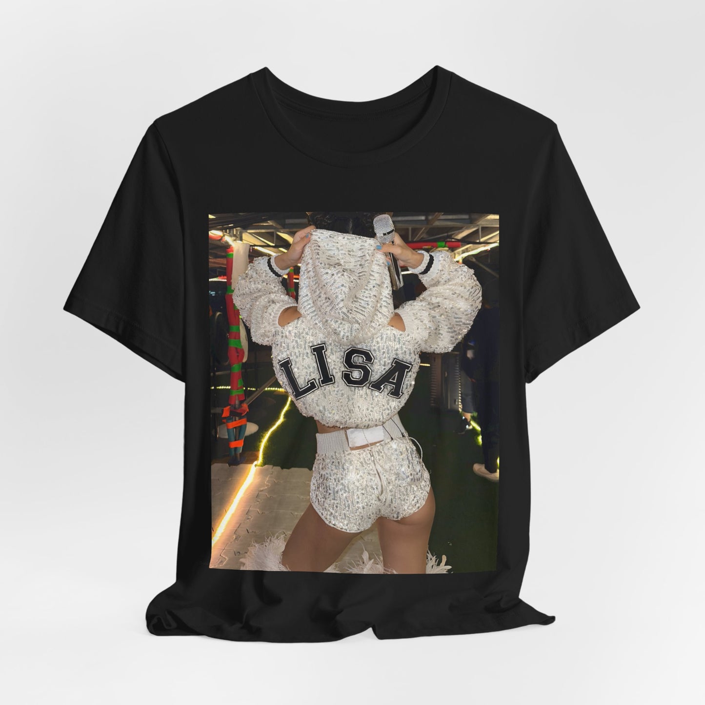 A black graphic t-shirt featuring a graphic or photo of Lisa in a backstage setting.
