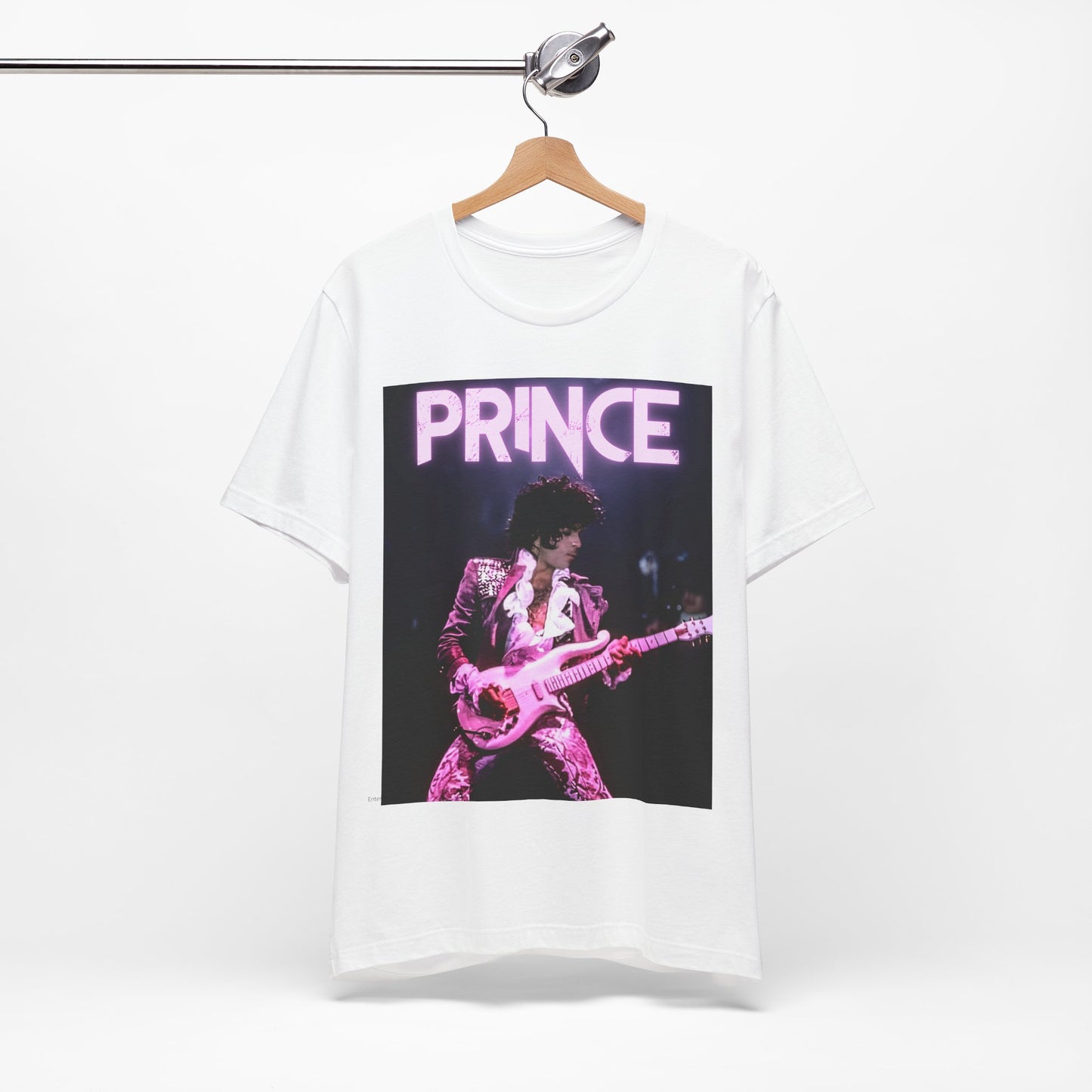 A black graphic t-shirt featuring an 80s pop genius graphic of Prince.