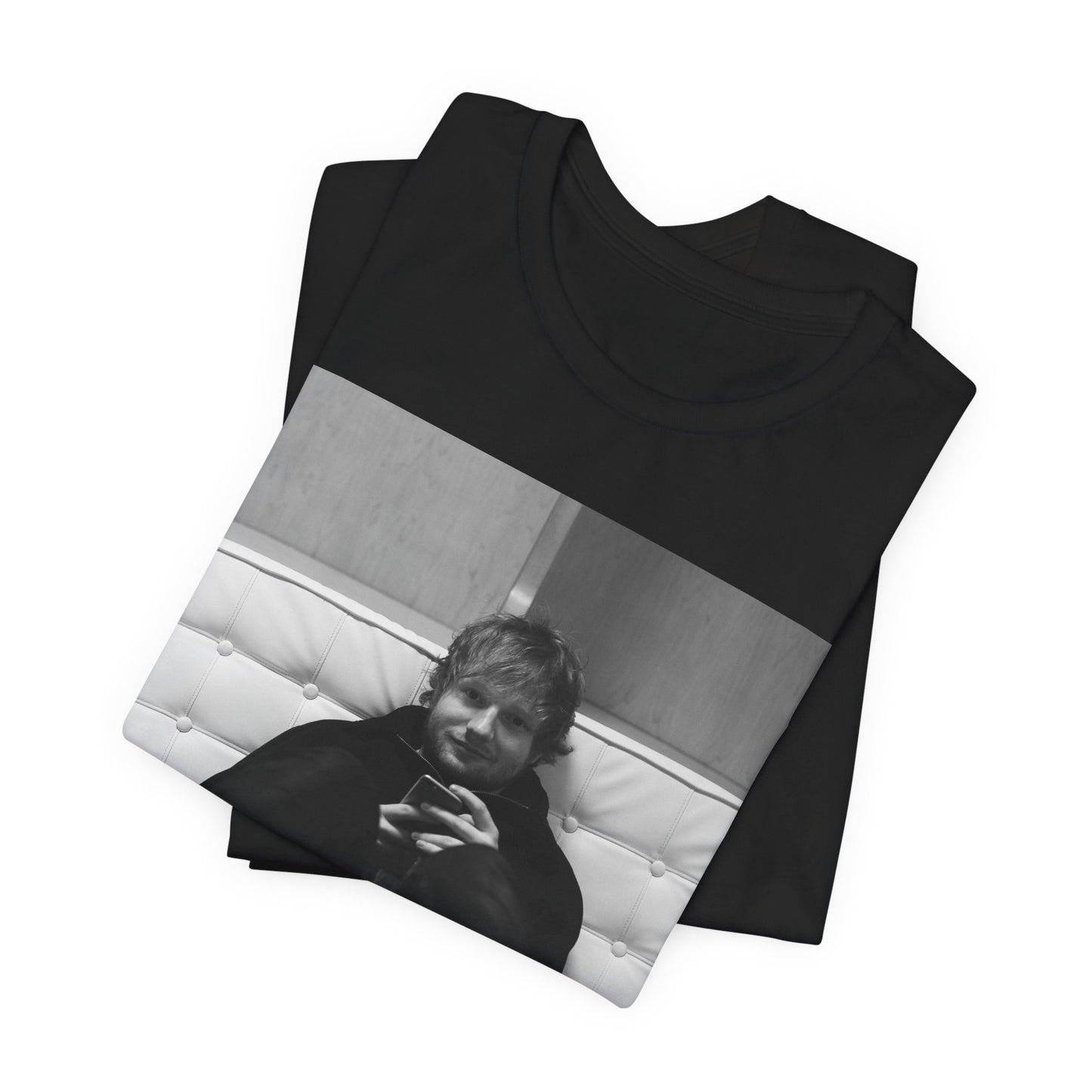 A black graphic t-shirt featuring a bold black and white graphic of Ed Sheeran.