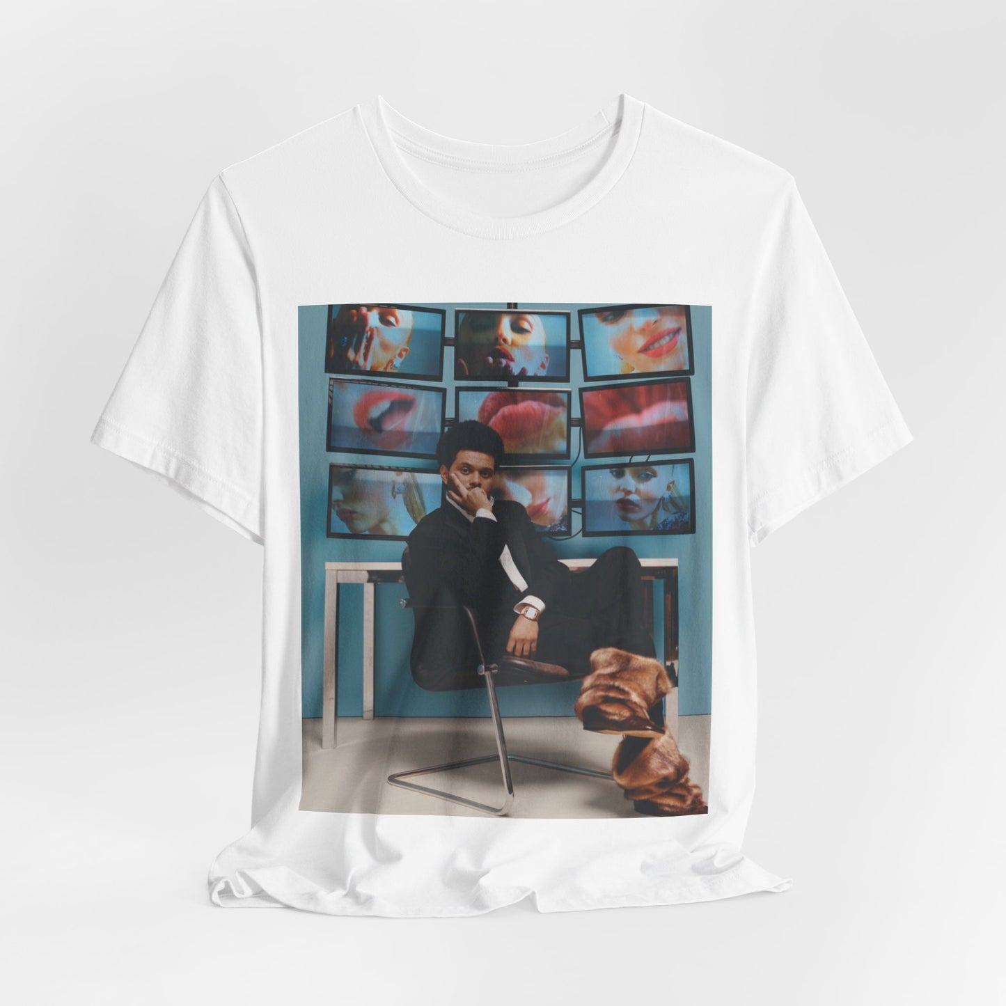 A black graphic t-shirt featuring an aesthetic graphic of The Weeknd.