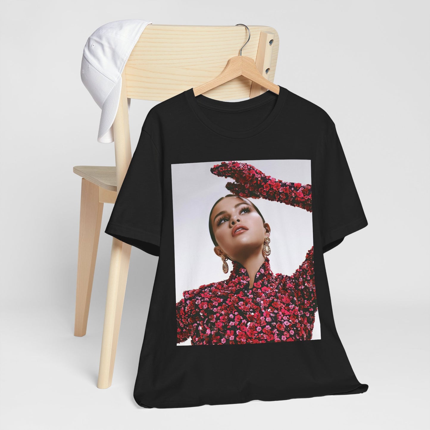A black graphic t-shirt featuring a classic aesthetic graphic of Selena Gomez.