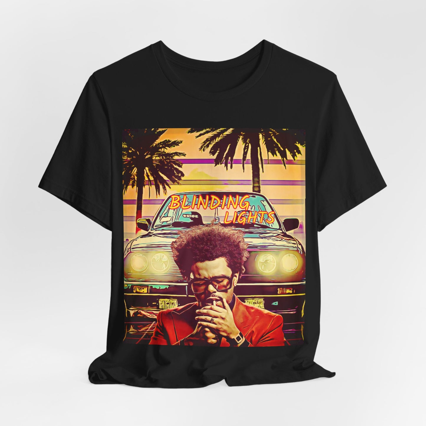 A black graphic t-shirt featuring a graphic related to The Weeknd's 'Blinding Lights' song.