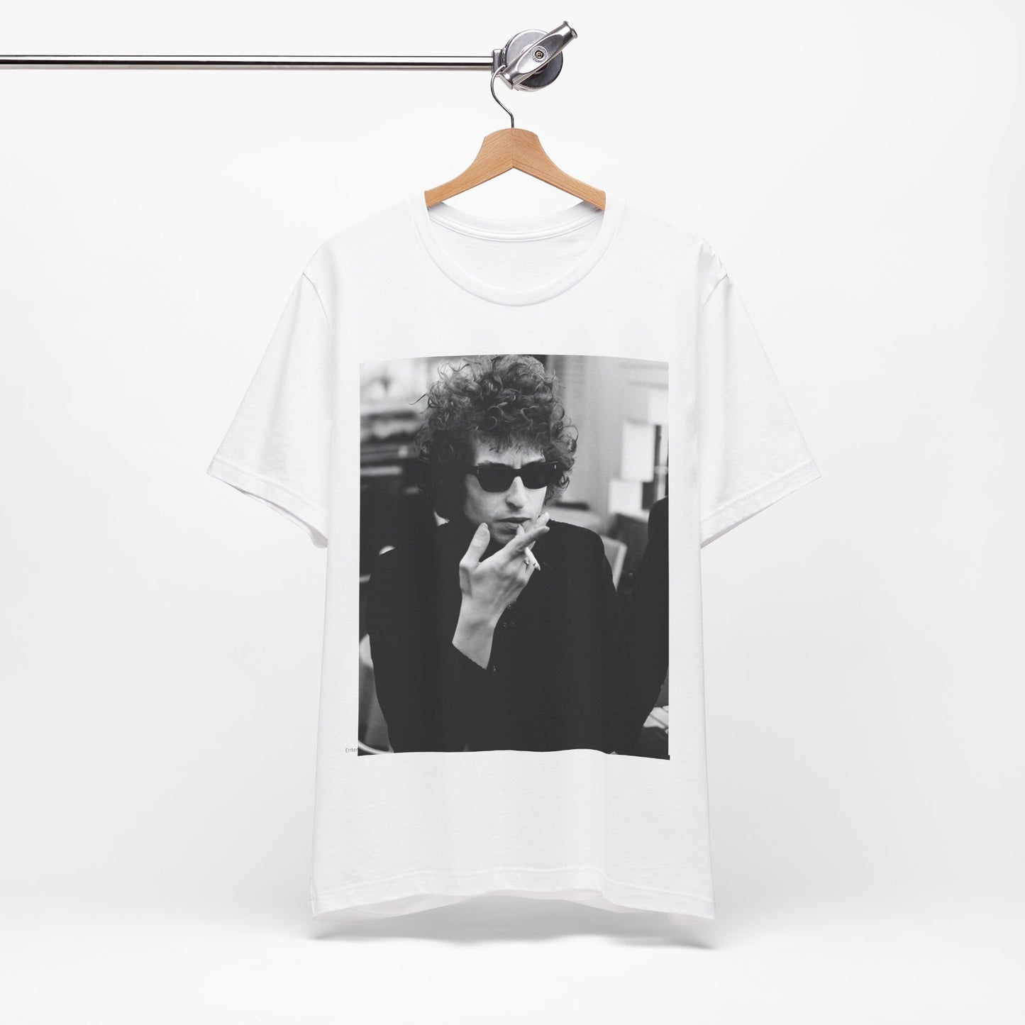 A black graphic t-shirt featuring a retro black and white graphic of Bob Dylan in a rebellious pose.