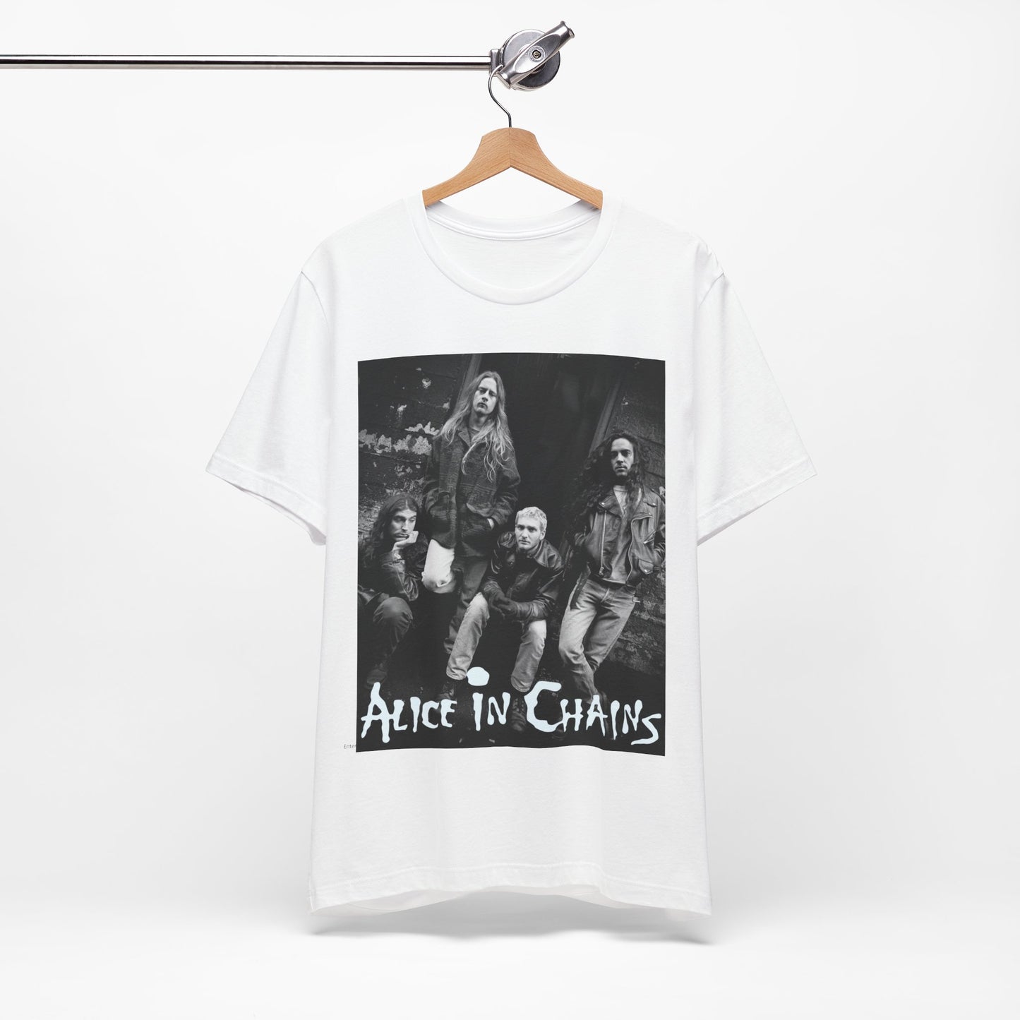 A black graphic t-shirt featuring a 90s black and white photographic portrait of the band Alice In Chains, capturing their iconic grunge look.