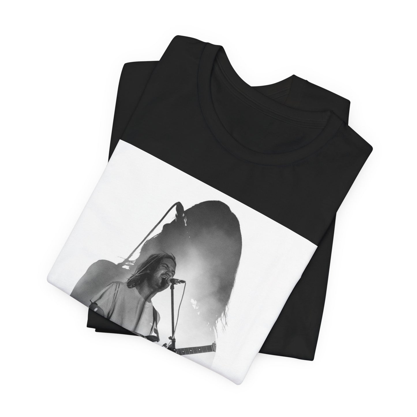 A black graphic t-shirt featuring a black and white, monochrome graphic or photo of Tame Impala.