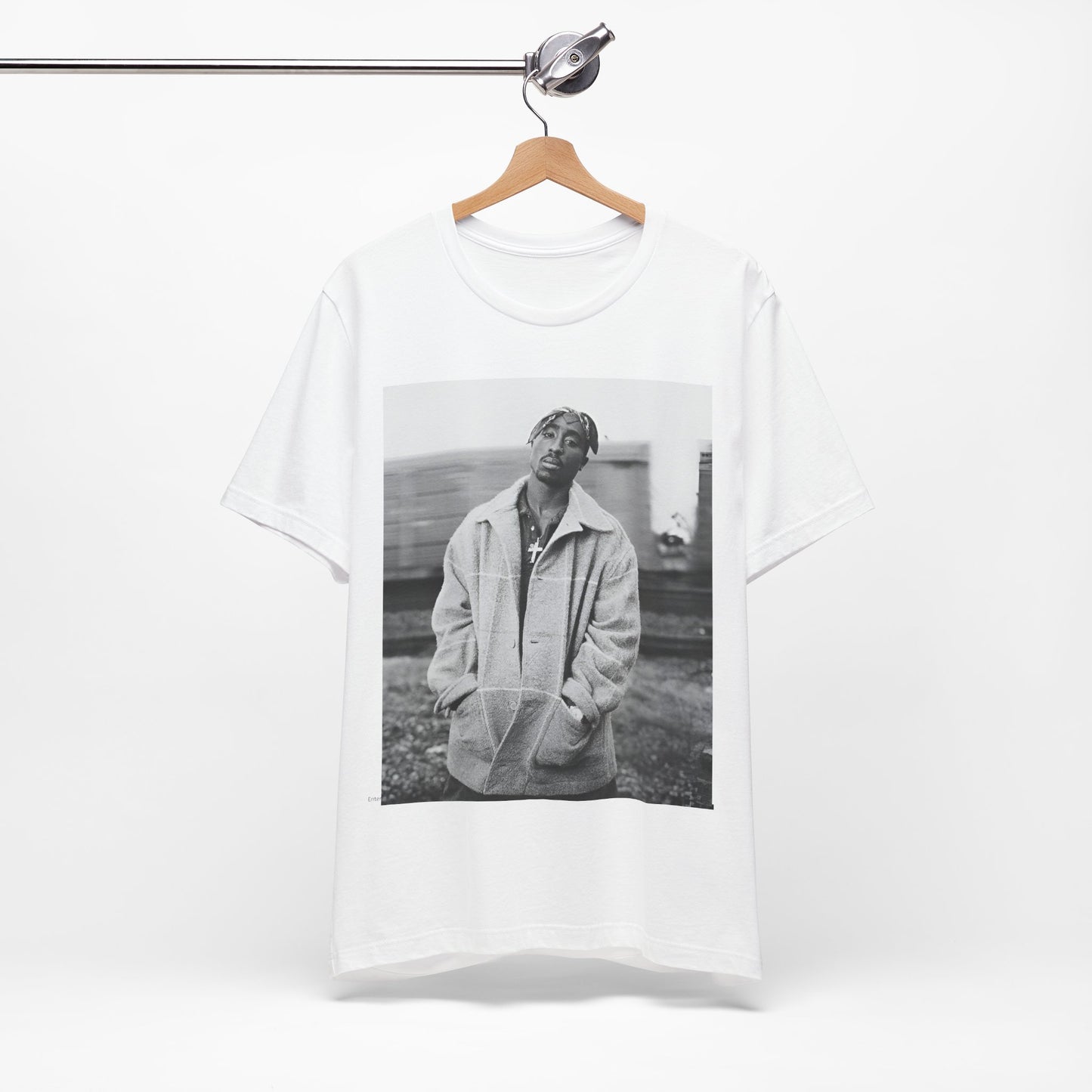A black graphic t-shirt featuring a graphic related to Tupac's 'Thug Life' philosophy.