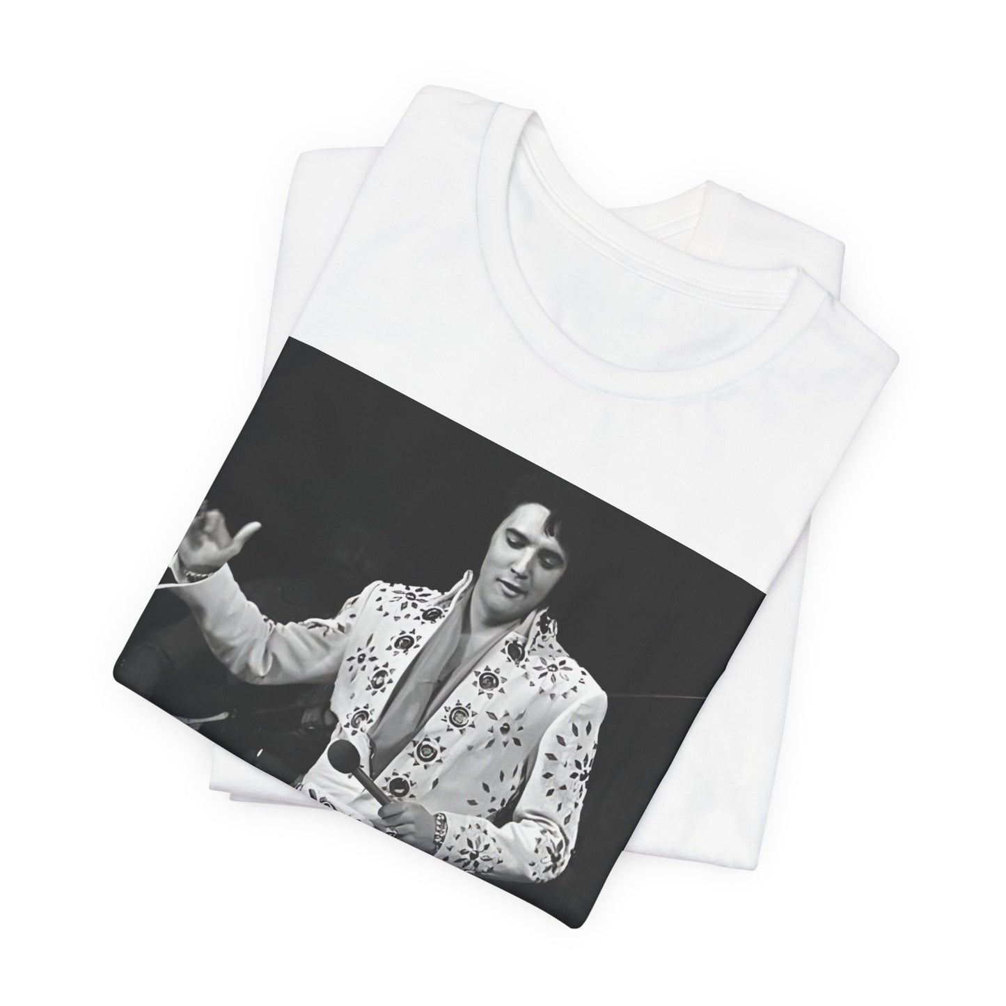A black graphic t-shirt featuring a stylized graphic of Elvis Presley as The King of Rock 'n' Roll.