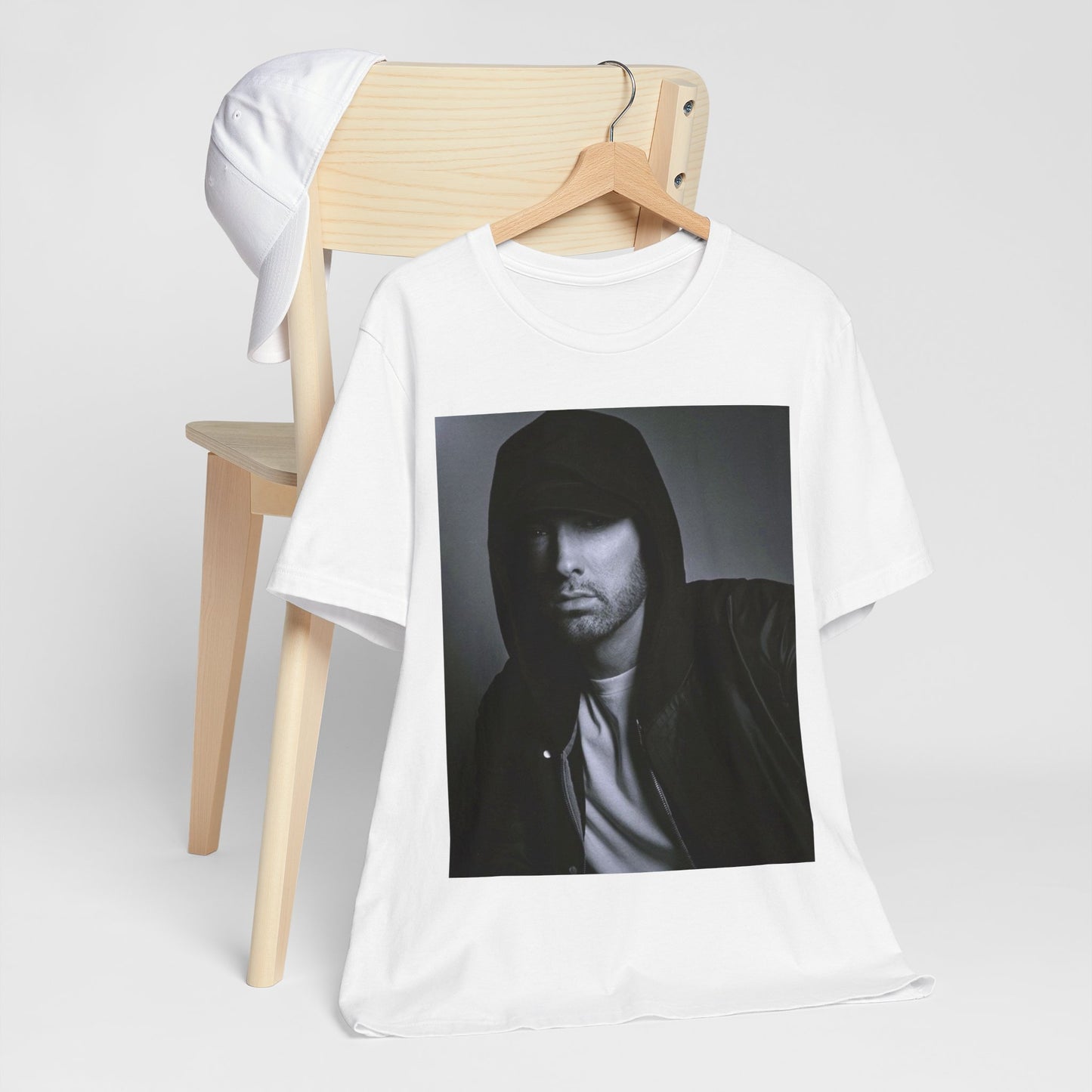 A black graphic t-shirt featuring a black and white, monochrome graphic or photo of Eminem.