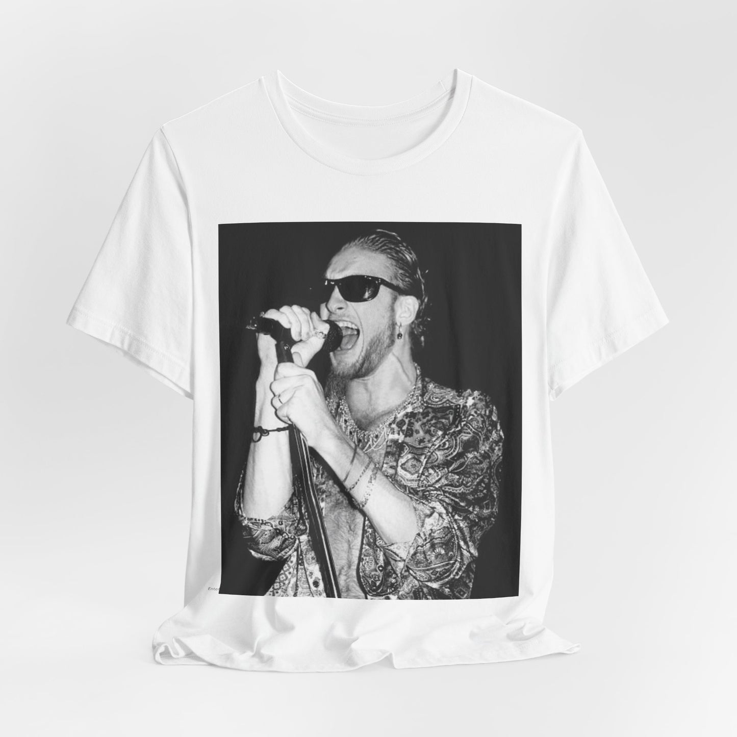 A black graphic t-shirt featuring an iconic black and white portrait photo of Layne Staley from Alice In Chains, showing his distinctive look.