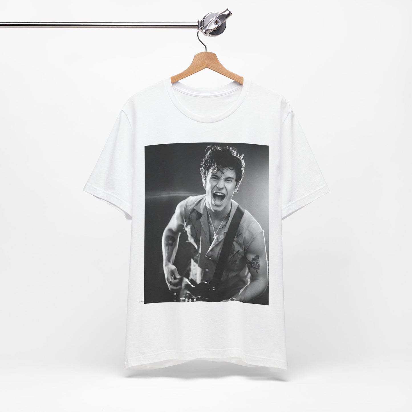 A black graphic t-shirt featuring a black and white photo of Shawn Mendes, emphasizing his charm.