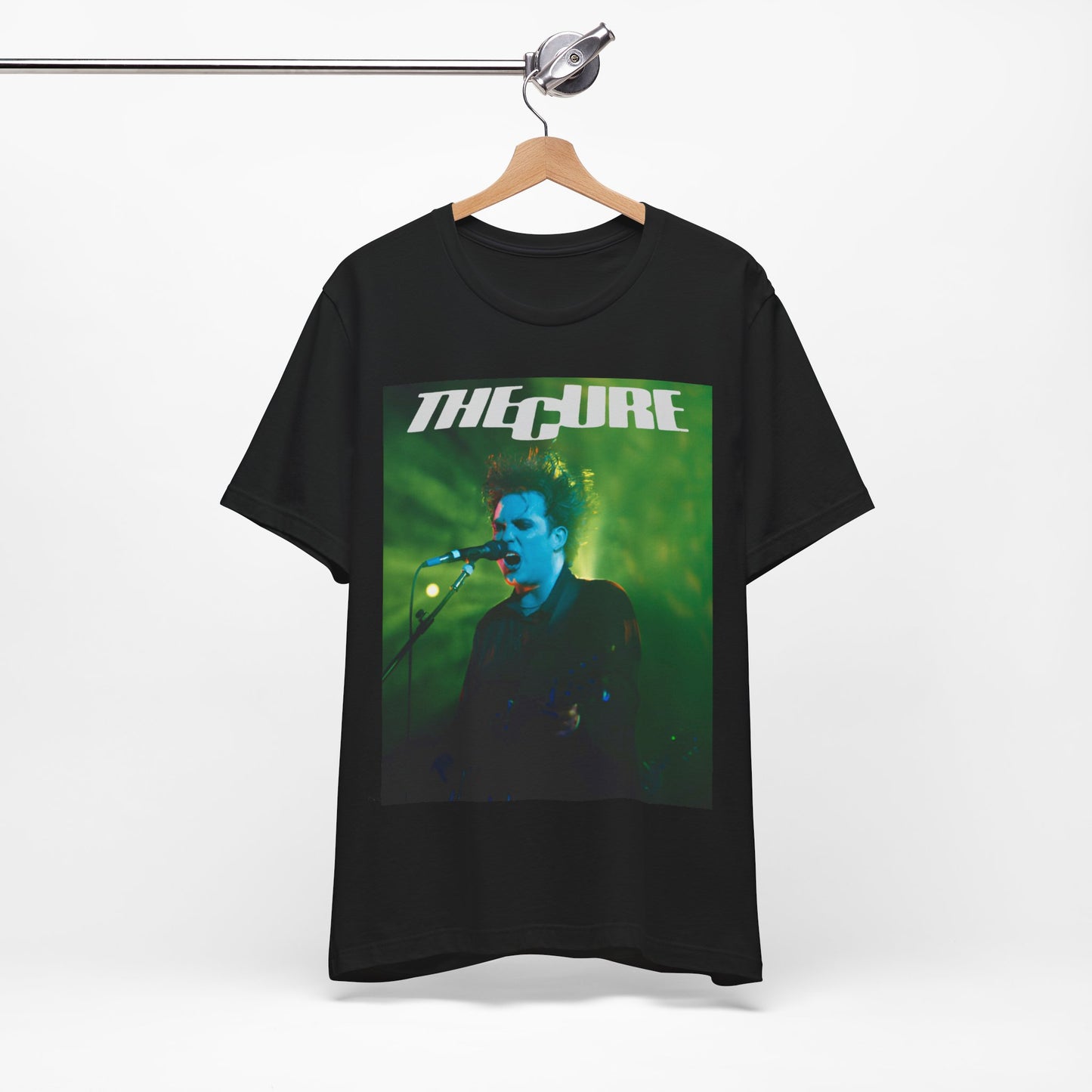 A black graphic t-shirt featuring a graphic or photo of The Cure performing live on stage.