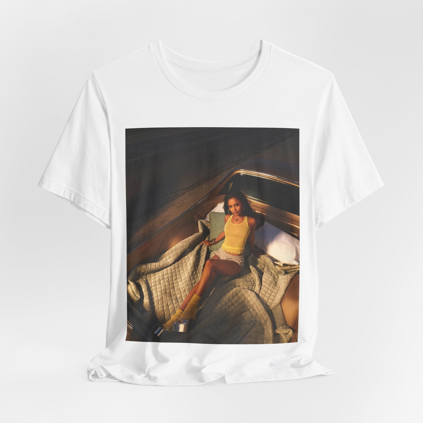 A black graphic t-shirt featuring a graphic of Tyla as an African fashion icon.