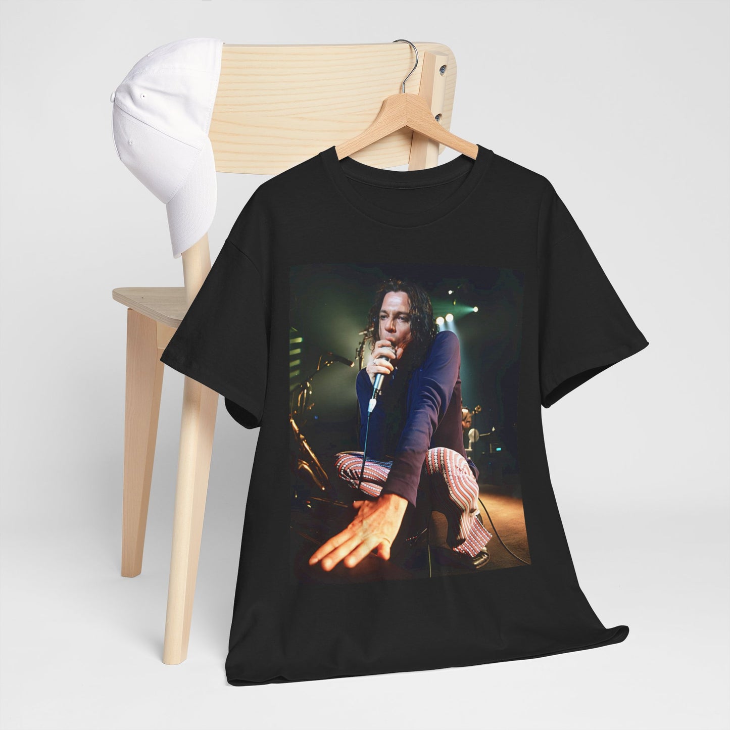 A black graphic t-shirt featuring a graphic related to INXS's 'Elegantly Wasted' album era.