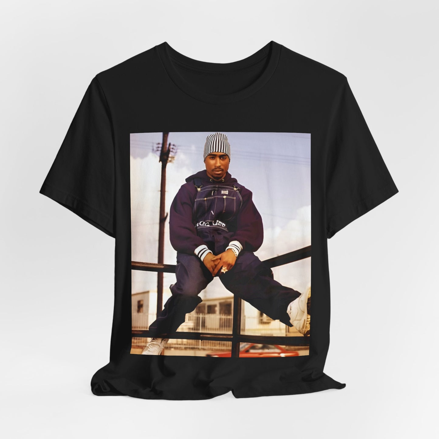 A black graphic t-shirt featuring a timeless rap legend graphic of Tupac.