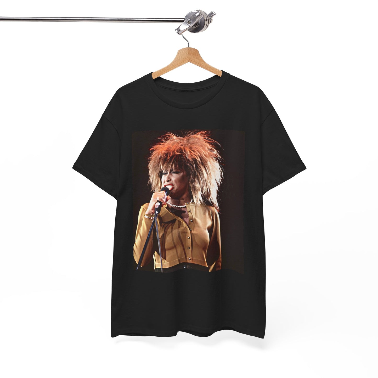 A black graphic t-shirt featuring a graphic of Tina Turner as a legendary rock icon.
