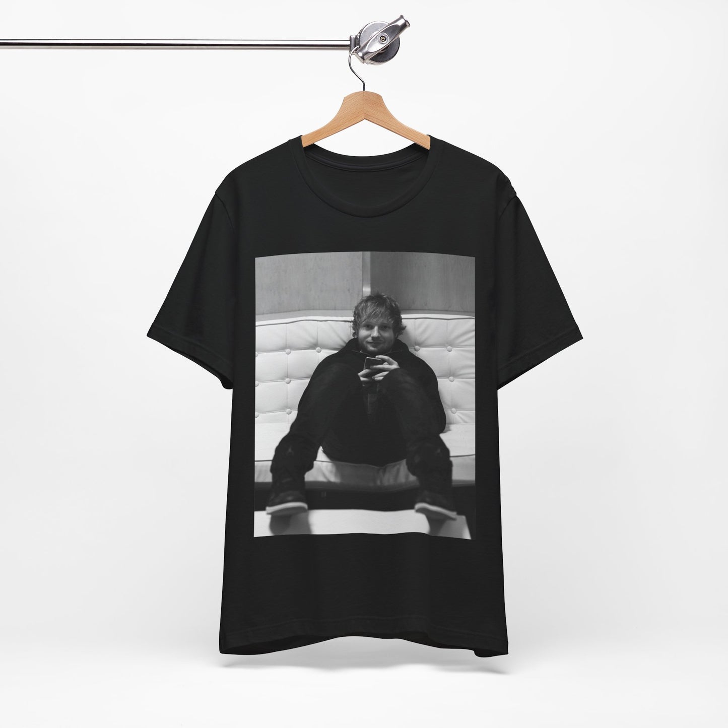 A black graphic t-shirt featuring a bold black and white graphic of Ed Sheeran.