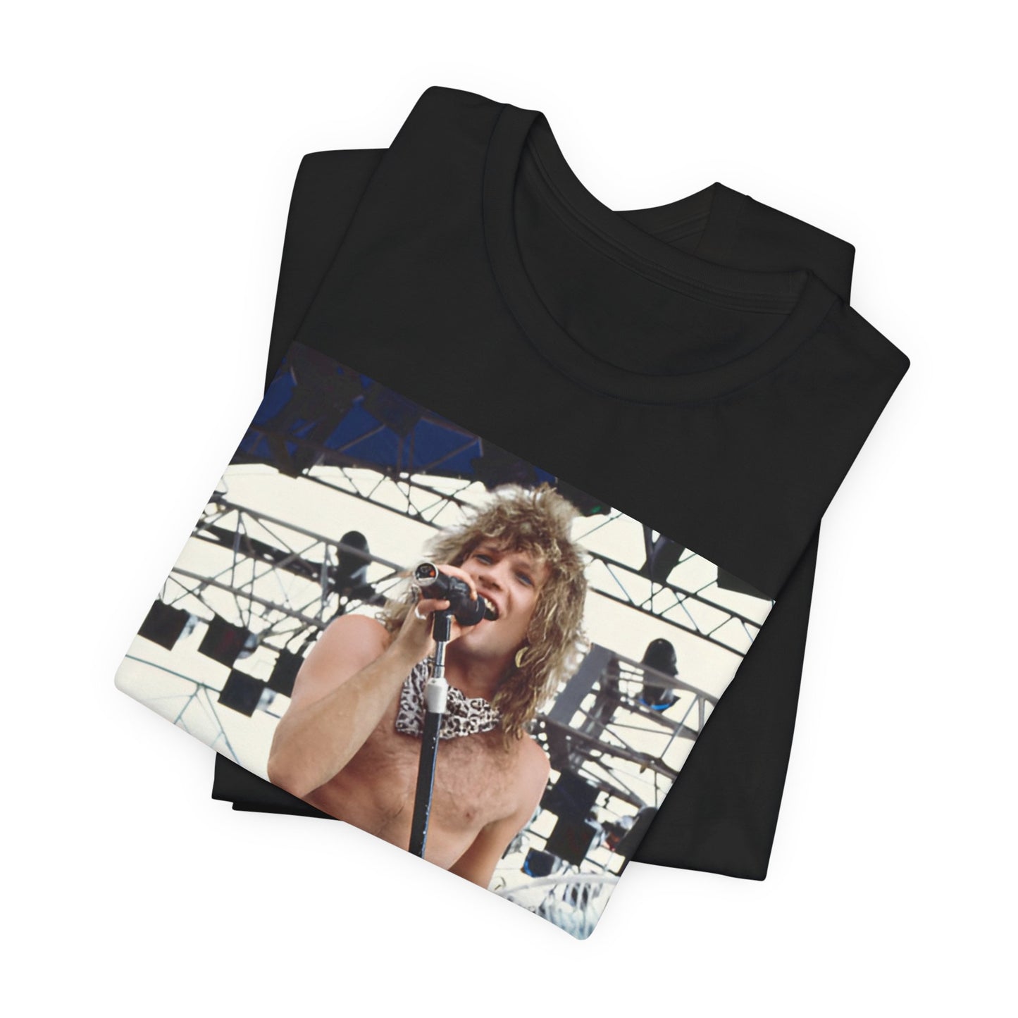 A black graphic t-shirt featuring a dynamic graphic or photo of Bon Jovi performing live on stage with a fierce intensity.