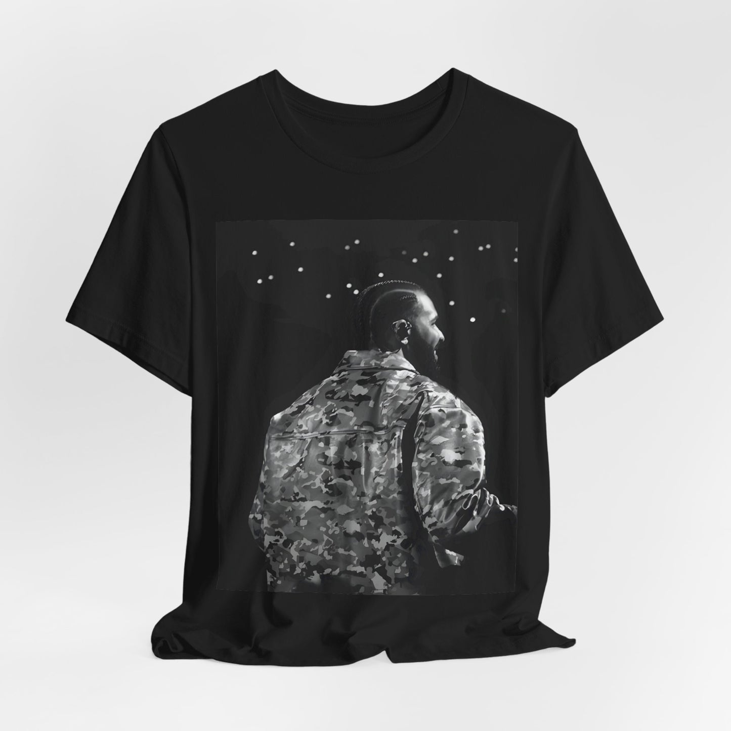 A black graphic t-shirt featuring a black and white graphic or photo of Drake performing live on stage.