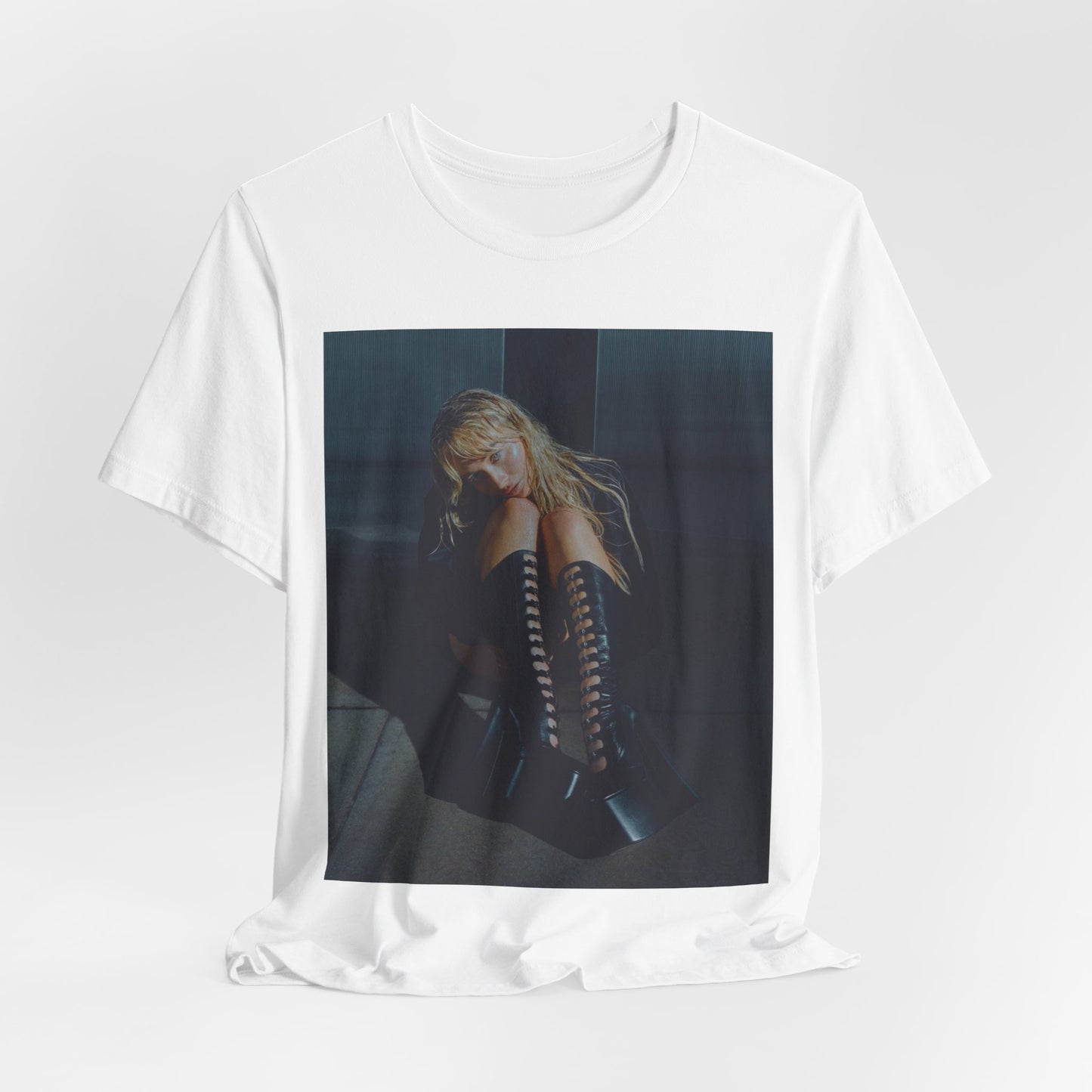 A black graphic t-shirt featuring a bold graphic of Sabrina Carpenter as a pop superstar.