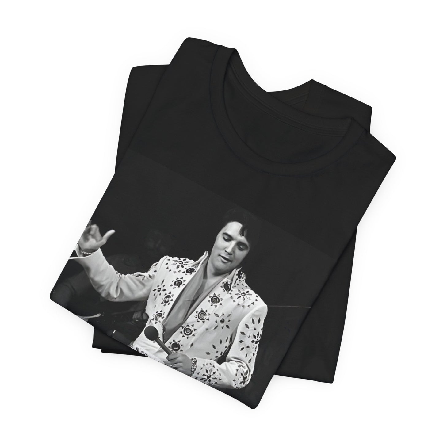 A black graphic t-shirt featuring a stylized graphic of Elvis Presley as The King of Rock 'n' Roll.