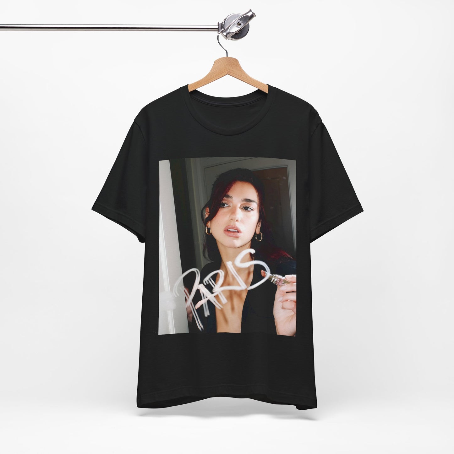 A black graphic t-shirt featuring a graphic of Dua Lipa, possibly with Parisian elements or a 'Paris' theme.