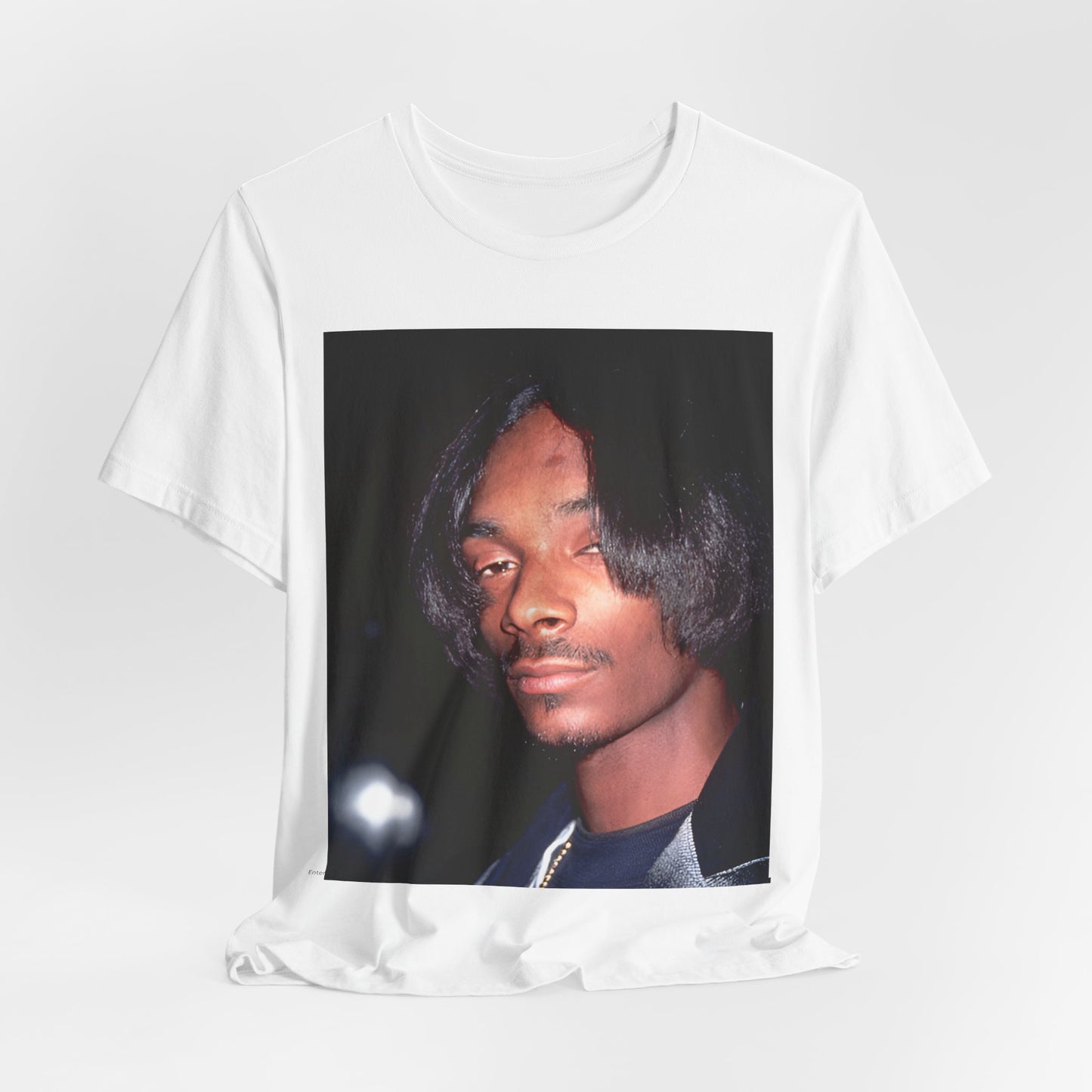 A black graphic t-shirt featuring a 90s black and white graphic of Snoop Dogg as a global icon in rap.