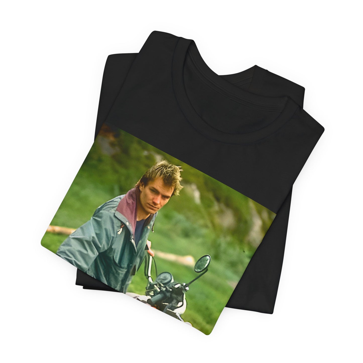 A black graphic t-shirt featuring a graphic of Sting from The Police with a motorcycle theme.