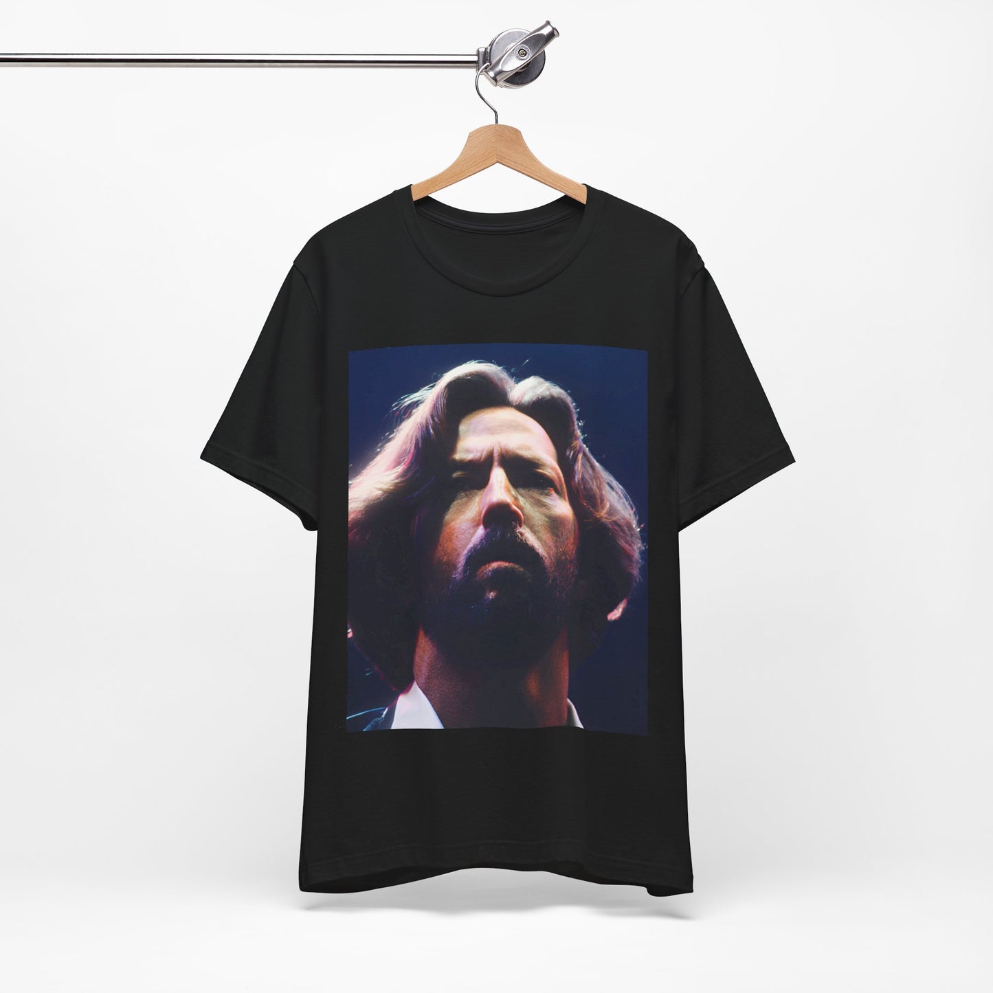 A black graphic t-shirt featuring a graphic related to Eric Clapton's 'Tears in Heaven' song or era.