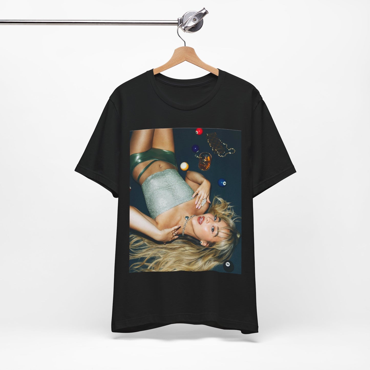 A black graphic t-shirt featuring a vintage pop icon graphic of Sabrina Carpenter.