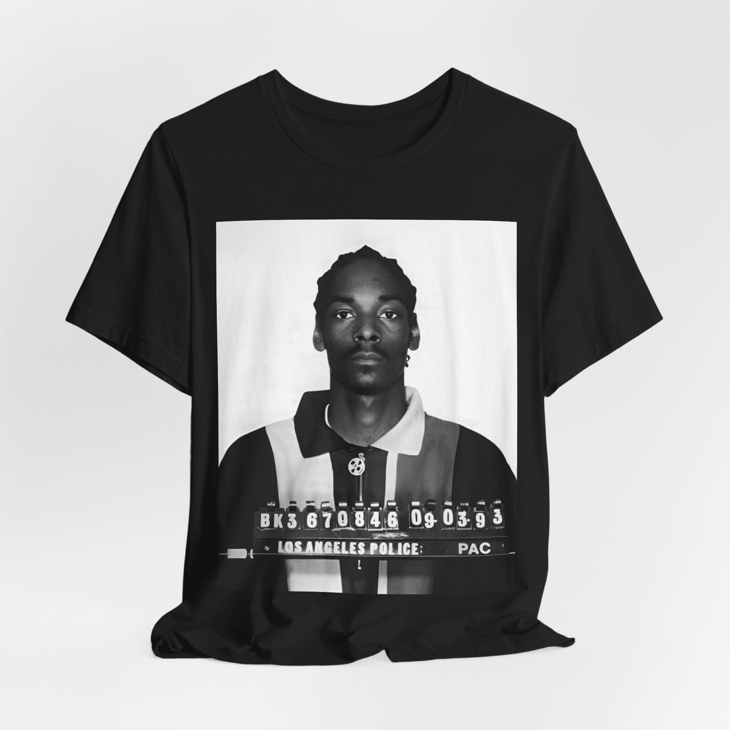 A black graphic t-shirt featuring a graphic of Snoop Dogg's mug shot.